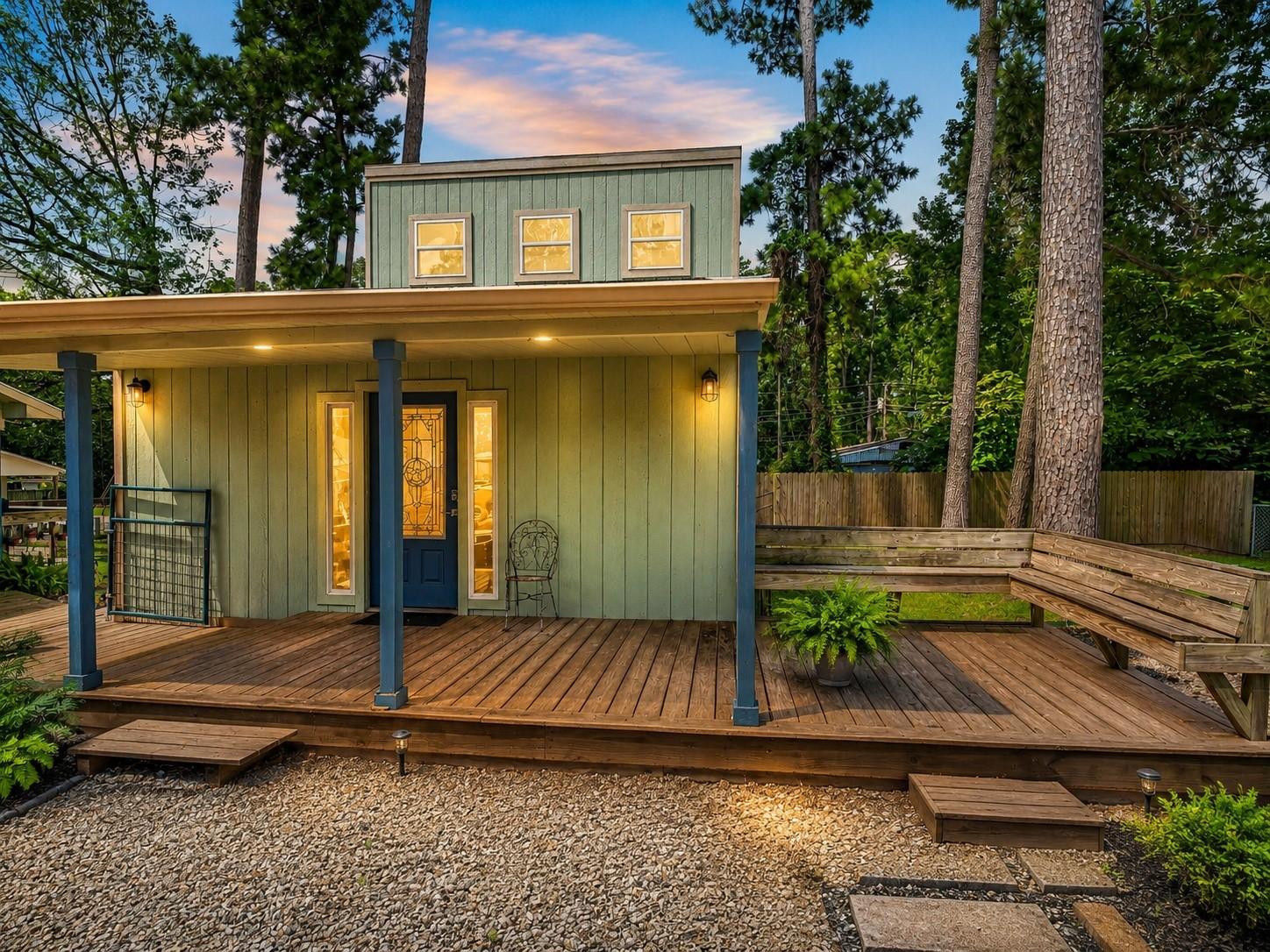 Image 2: Charming cabin-style exterior with expansive cover