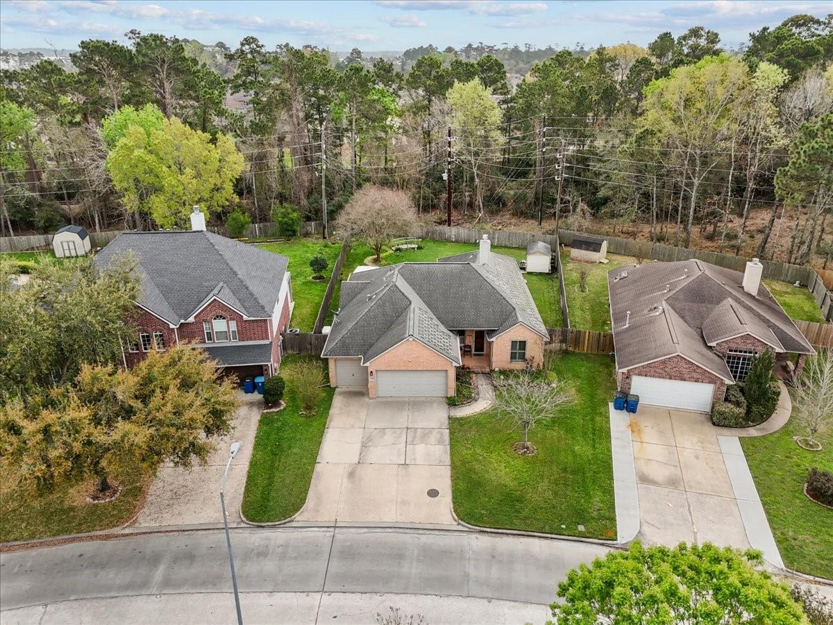 Image 2: This aerial photo showcases a charming suburban ne