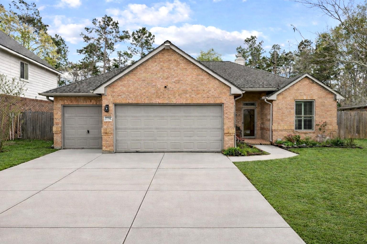 Image 3: Discover this charming single-story brick home, fe
