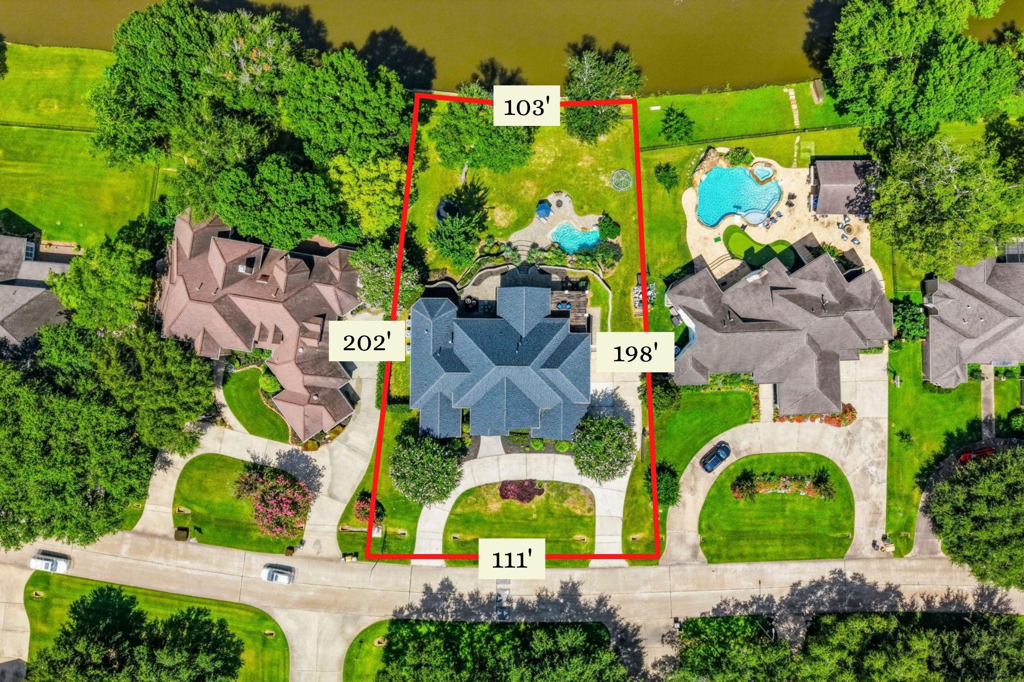 Image 2: Situated on a .52-acre waterfront lot with 111' of