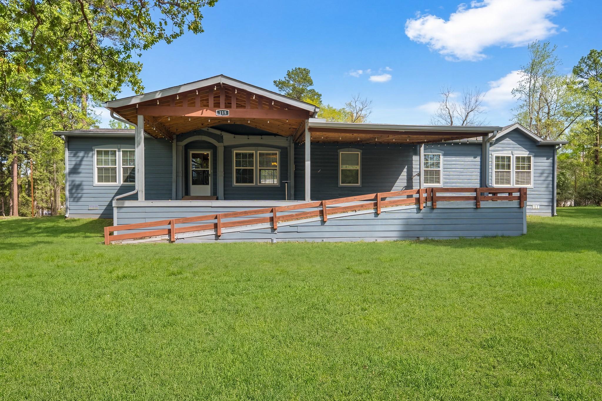 Image 3: Charming single-story blue house with a welcoming