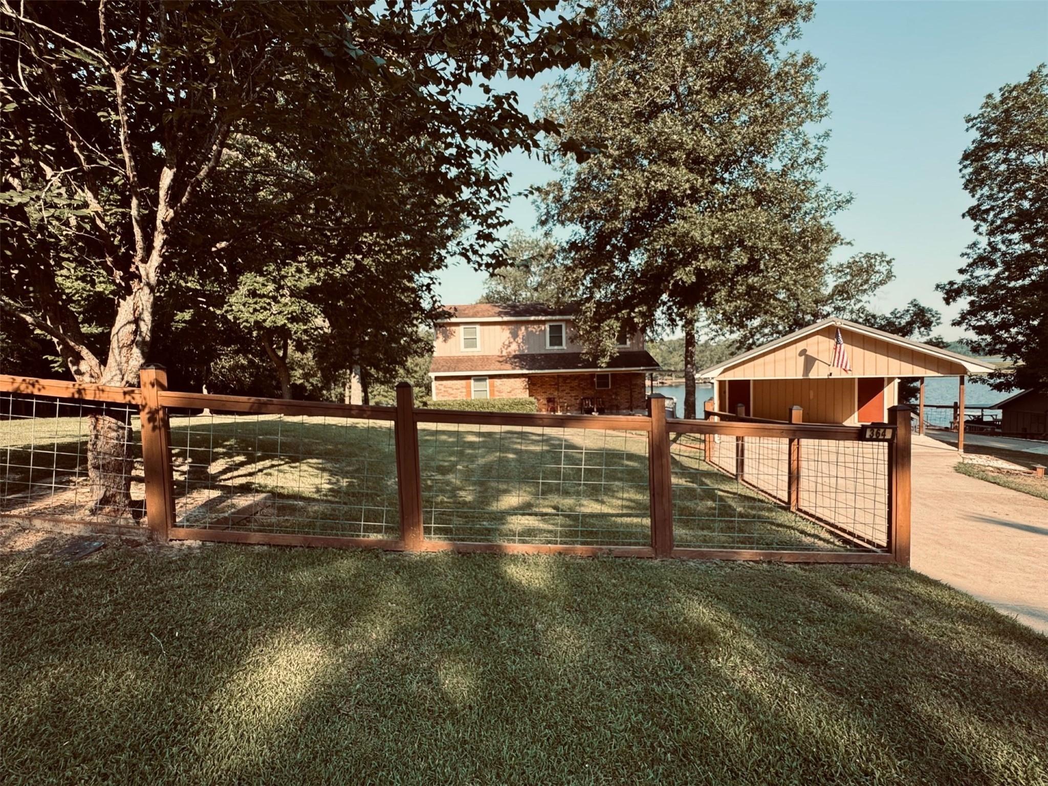 Image 3: Completely fenced, nice shade trees, long drive fo