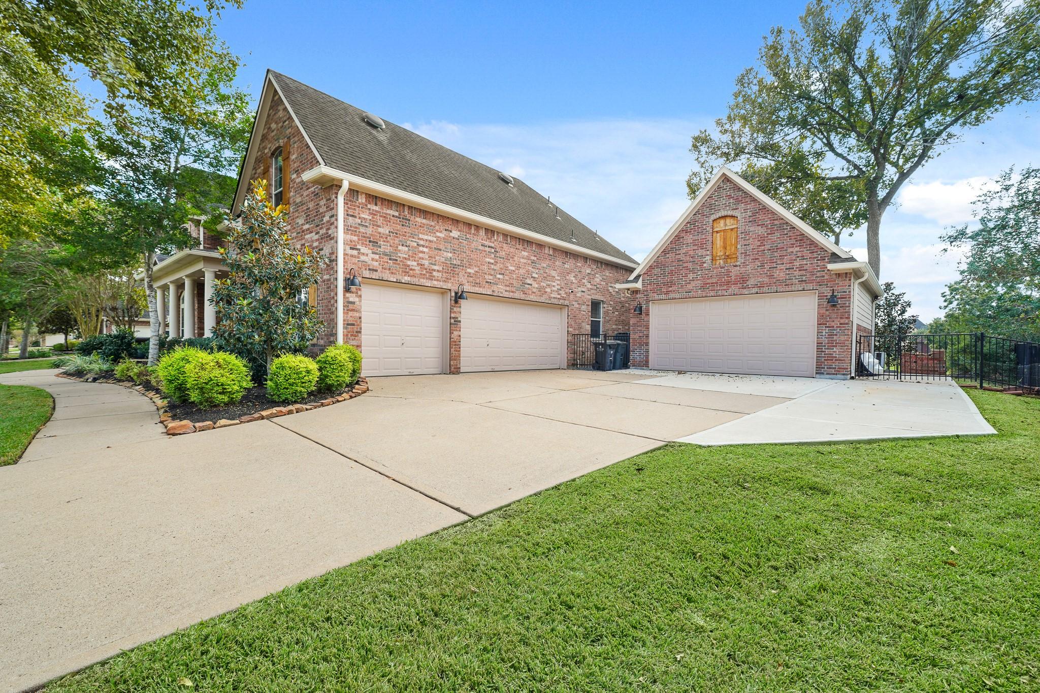 Image 2: A sweeping double-wide driveway welcomes you to th