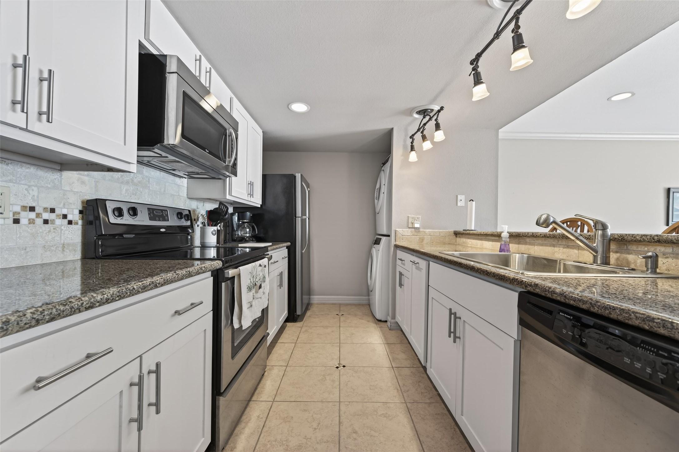 Image 2: Kitchen open to the Dining and Family room. Applia