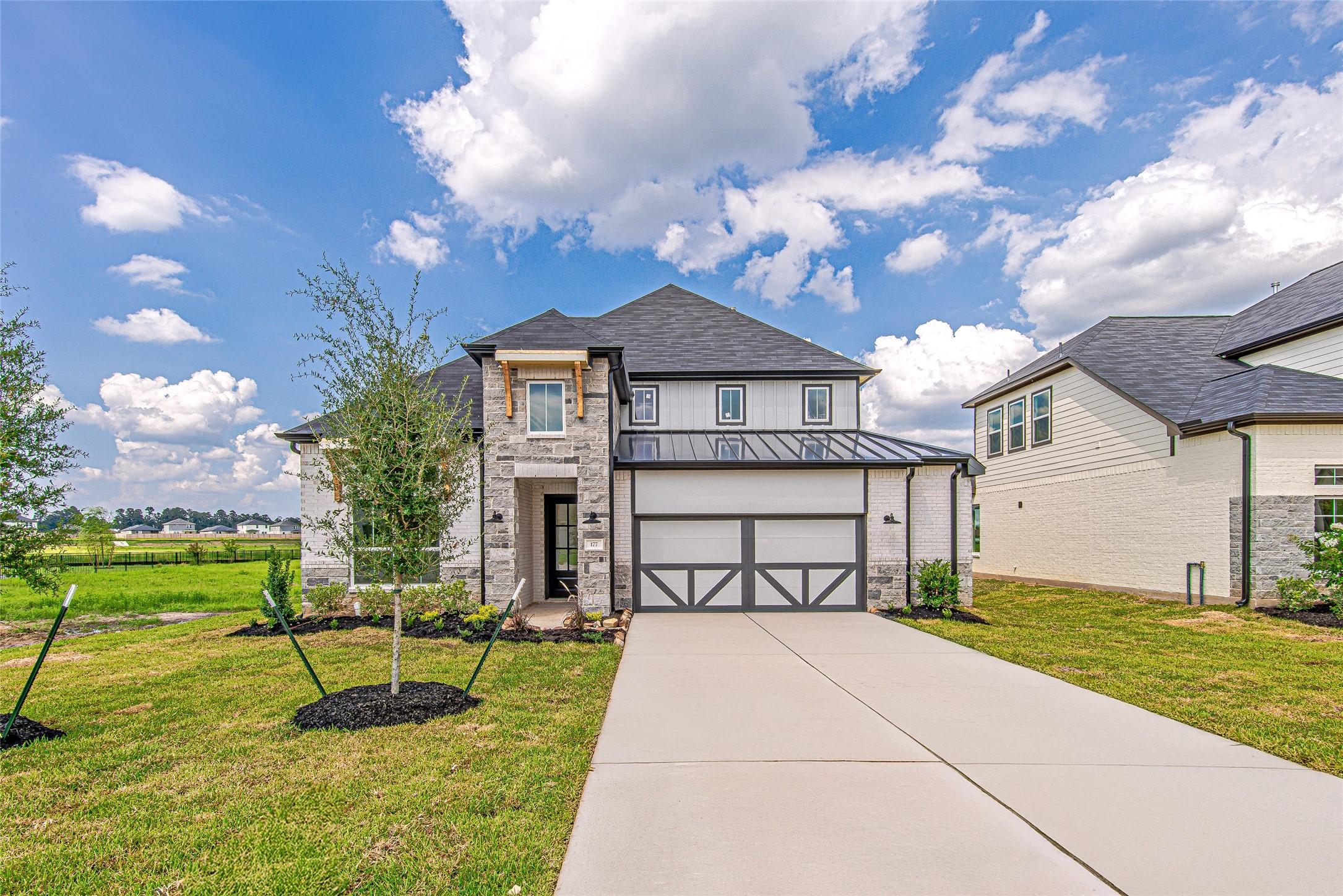 Image 1: Modern curb appeal meets timeless design with this