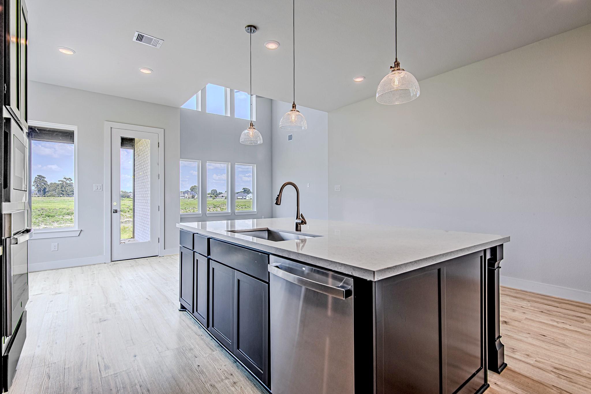 Image 4: Bright and open kitchen layout with expansive wind
