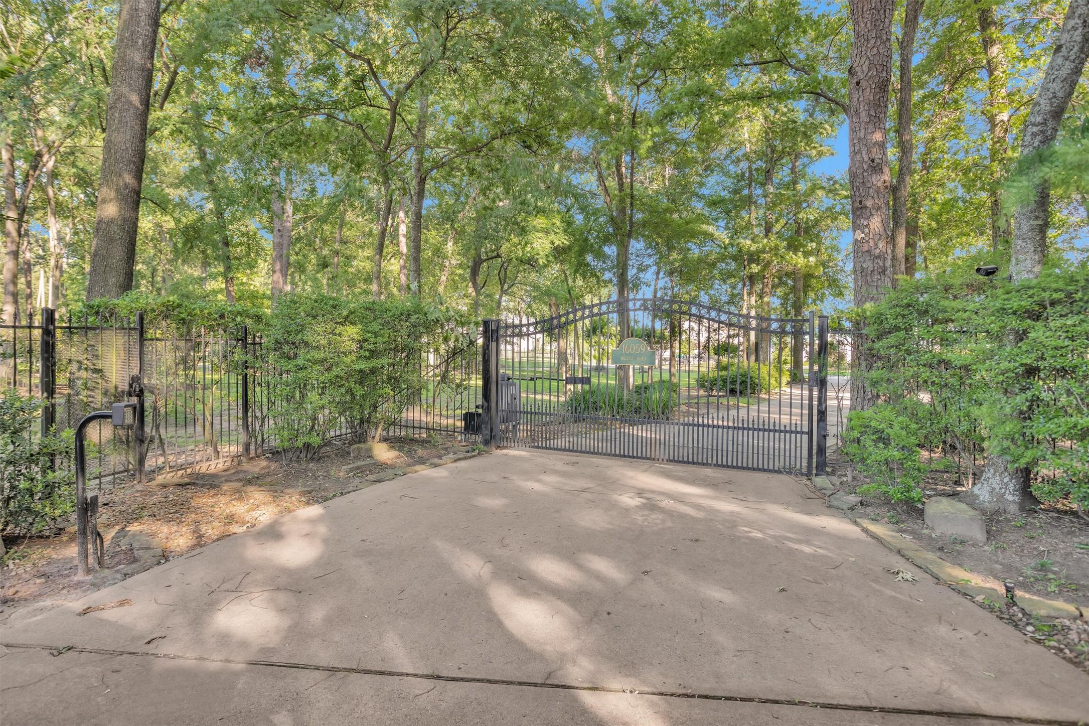 Image 3: This photo shows a gated entrance to a property, s