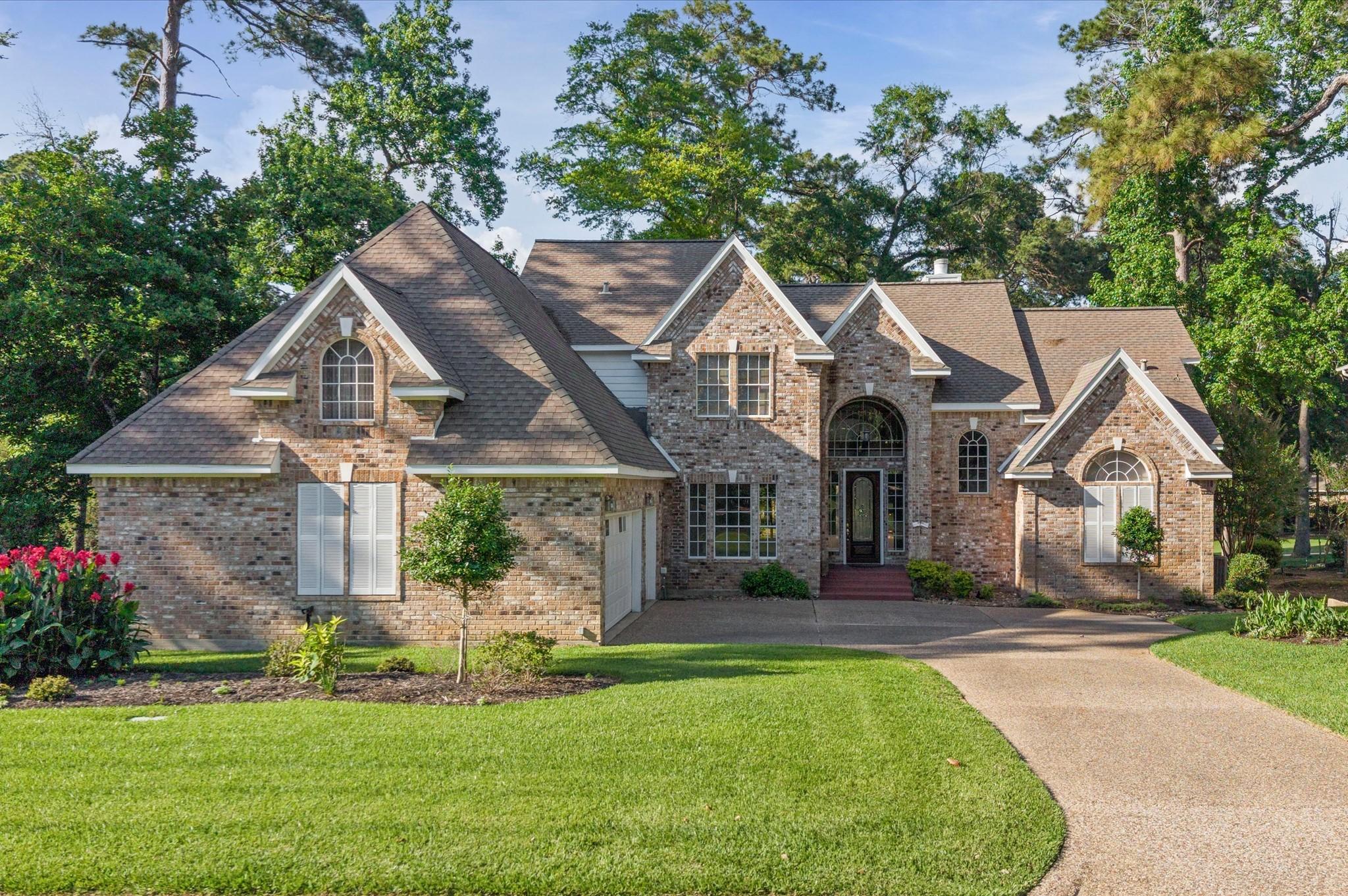 Image 3: Lush landscaping and stunning curb appeal