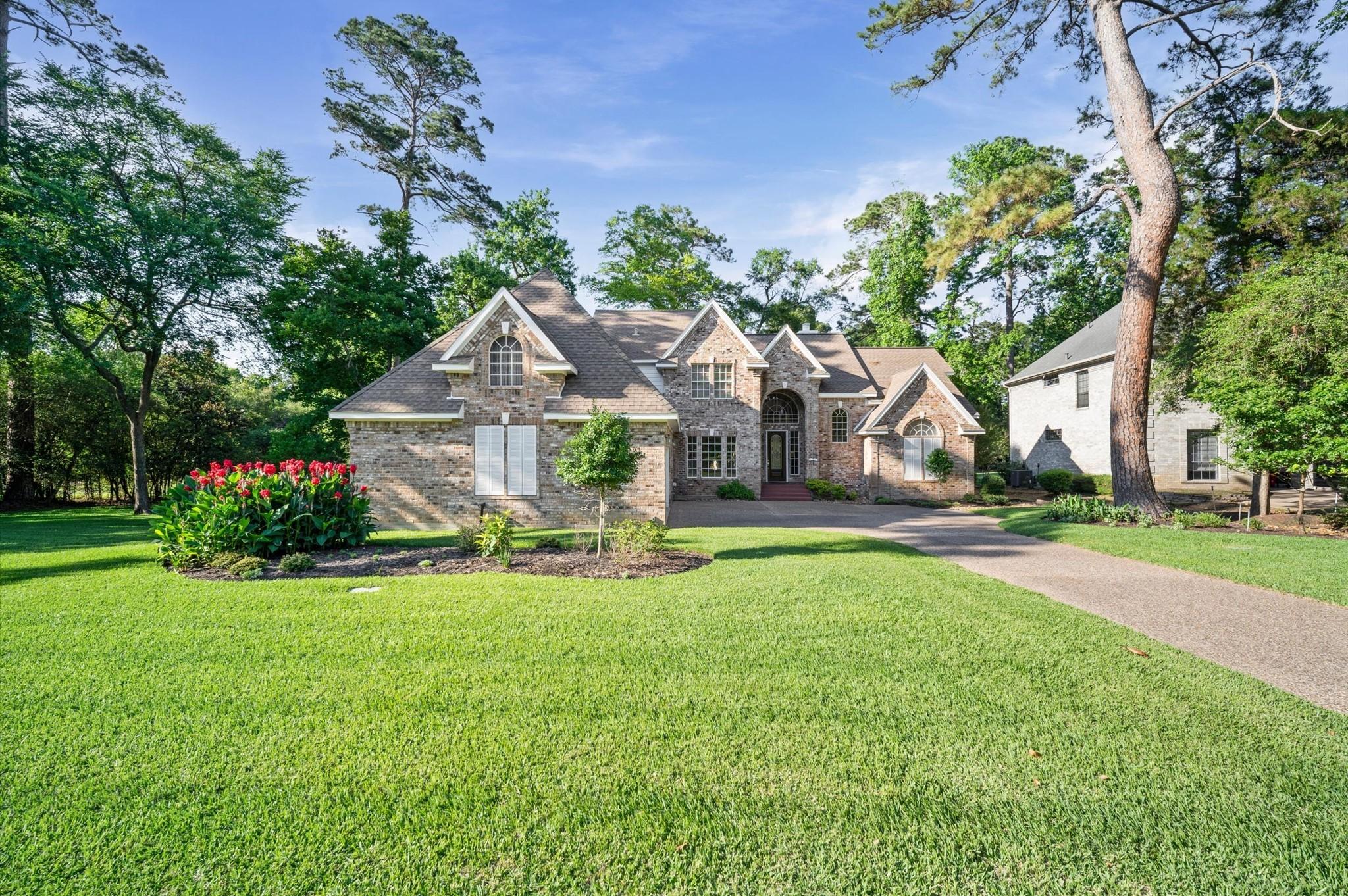Image 4: Lush landscaping and stunning curb appeal