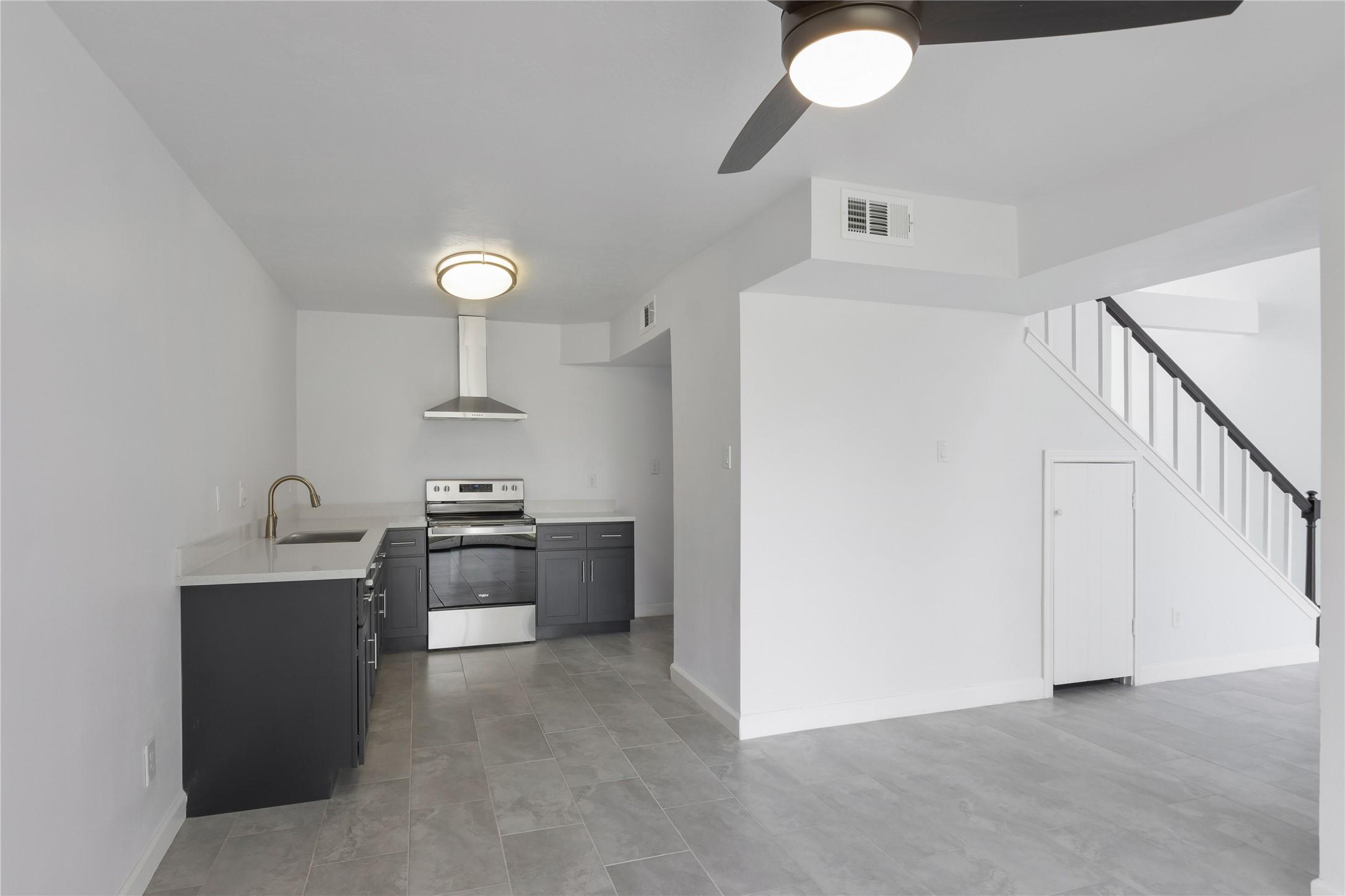 Image 3: kitchen offers a vaulted ceiling, private vanity a