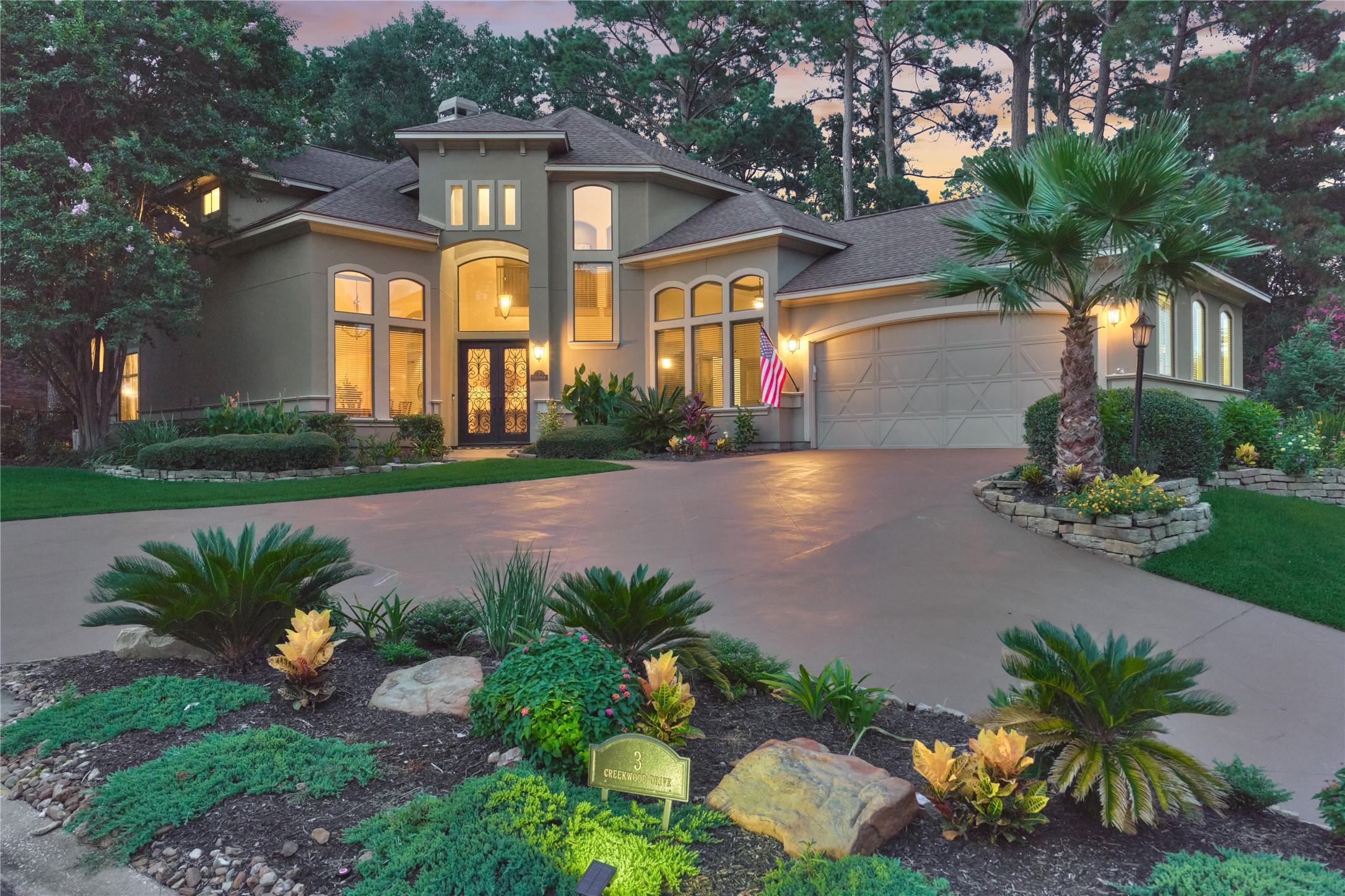 Image 1: Welcome to 3 Creekwood, a stunning custom home sur