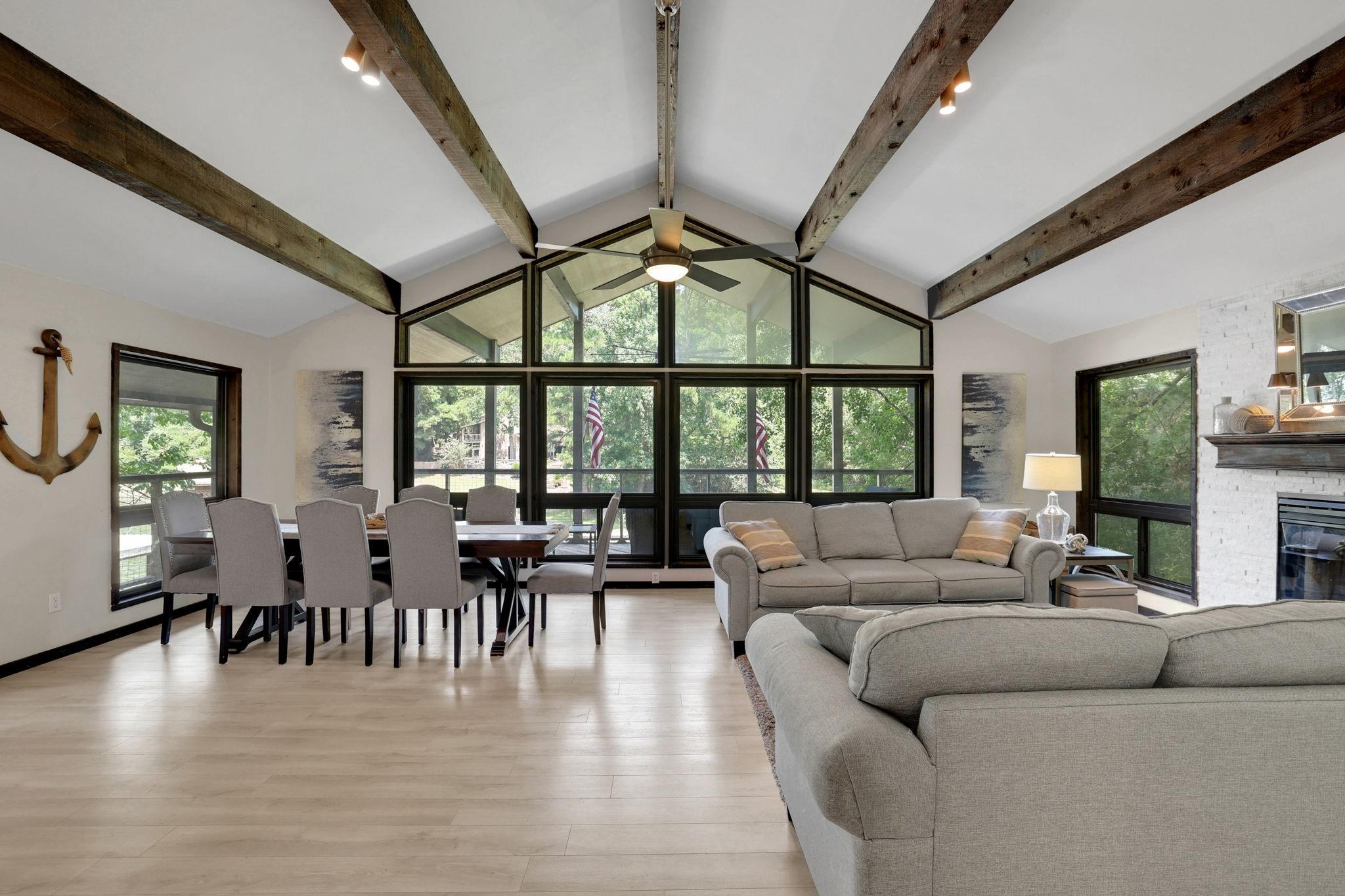 Image 4: As you flow into the living area, soaring ceilings