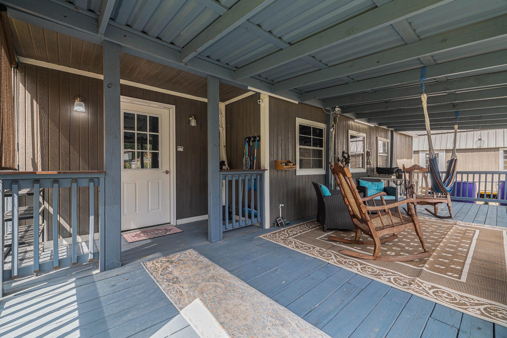 Image 4: Covered porch with railing, perfect for unwinding