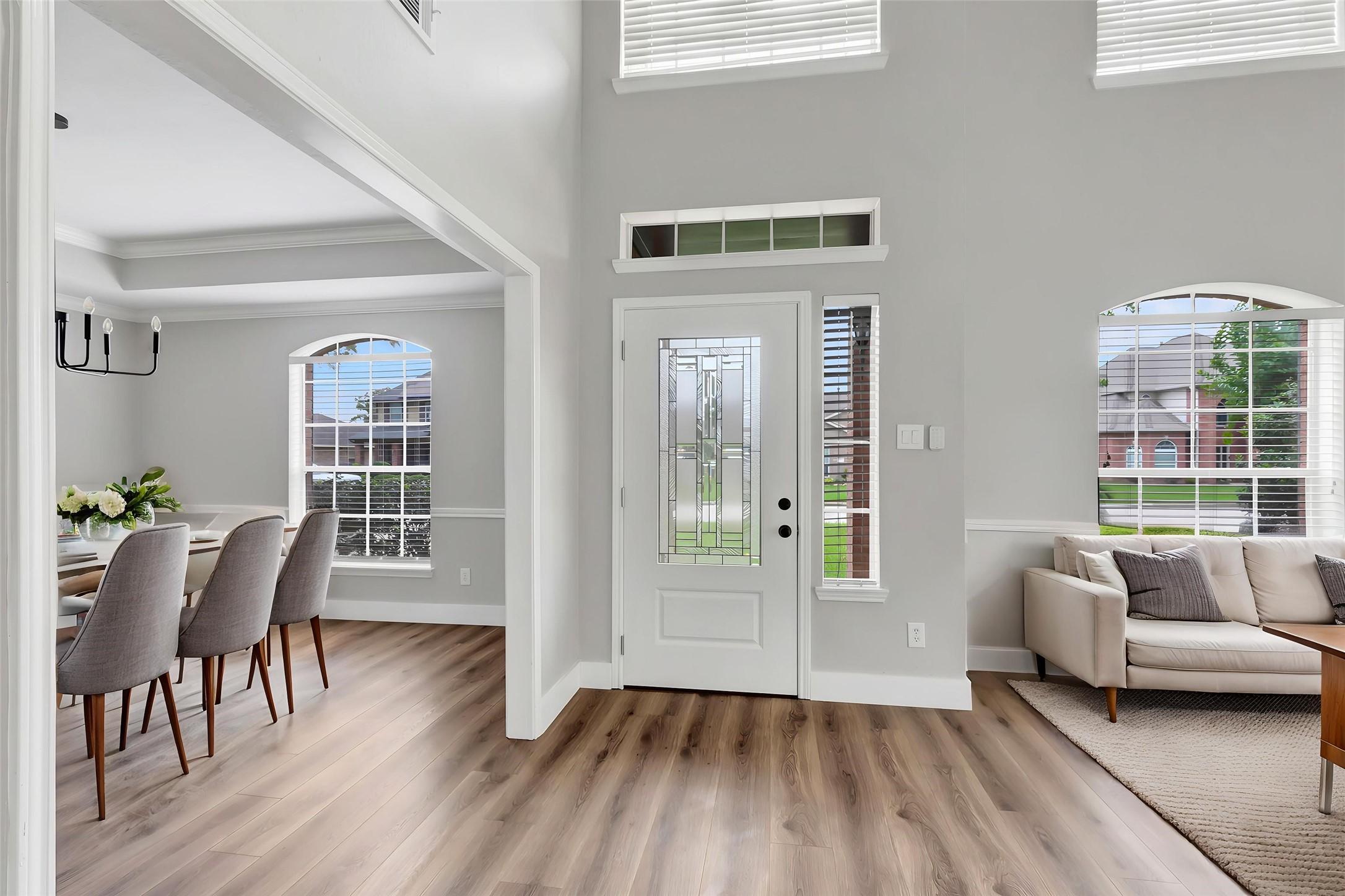 Image 4: Step inside to a light-filled, two-story entry wit