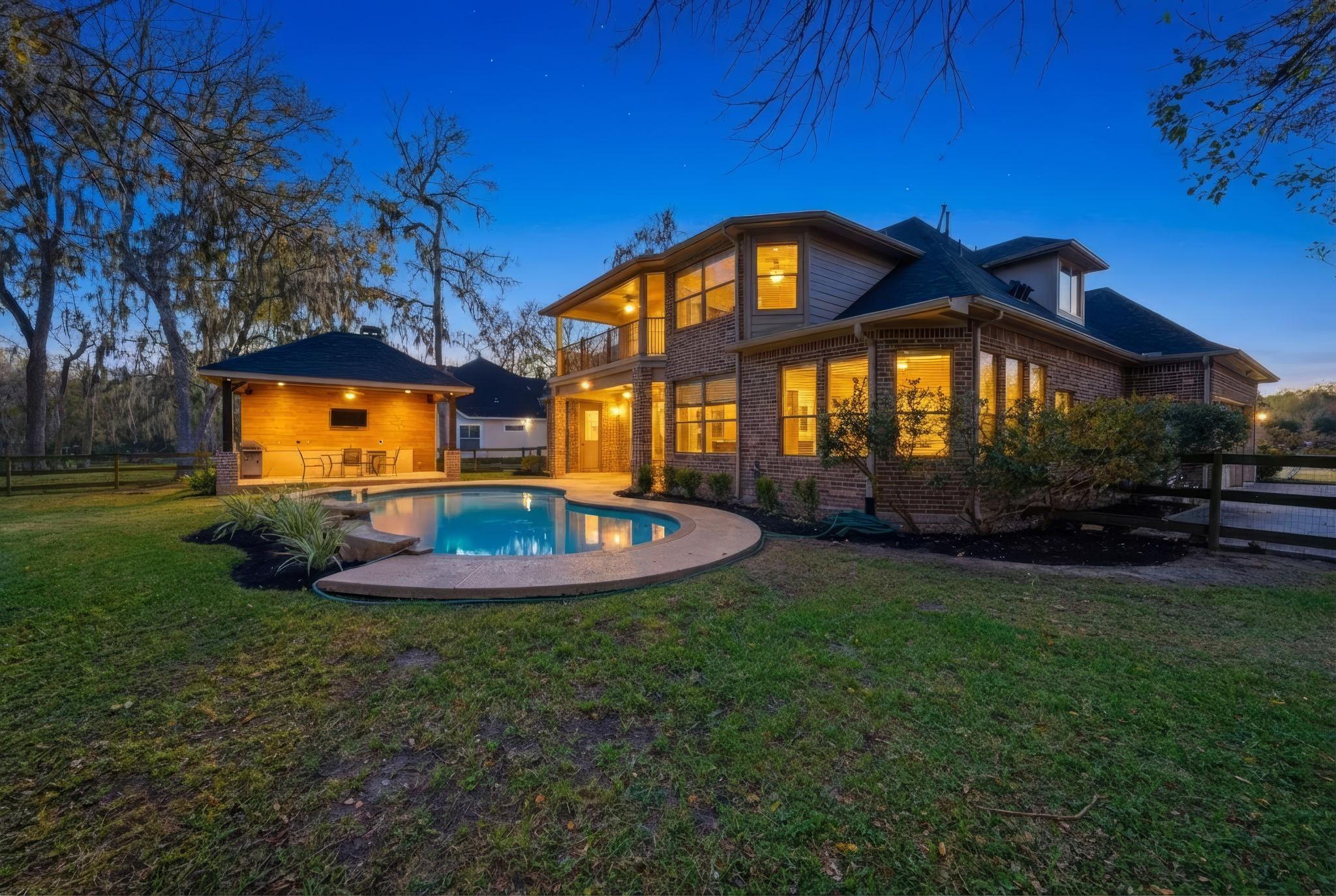 Image 2: Situated on a generous half-acre lot, this stunnin