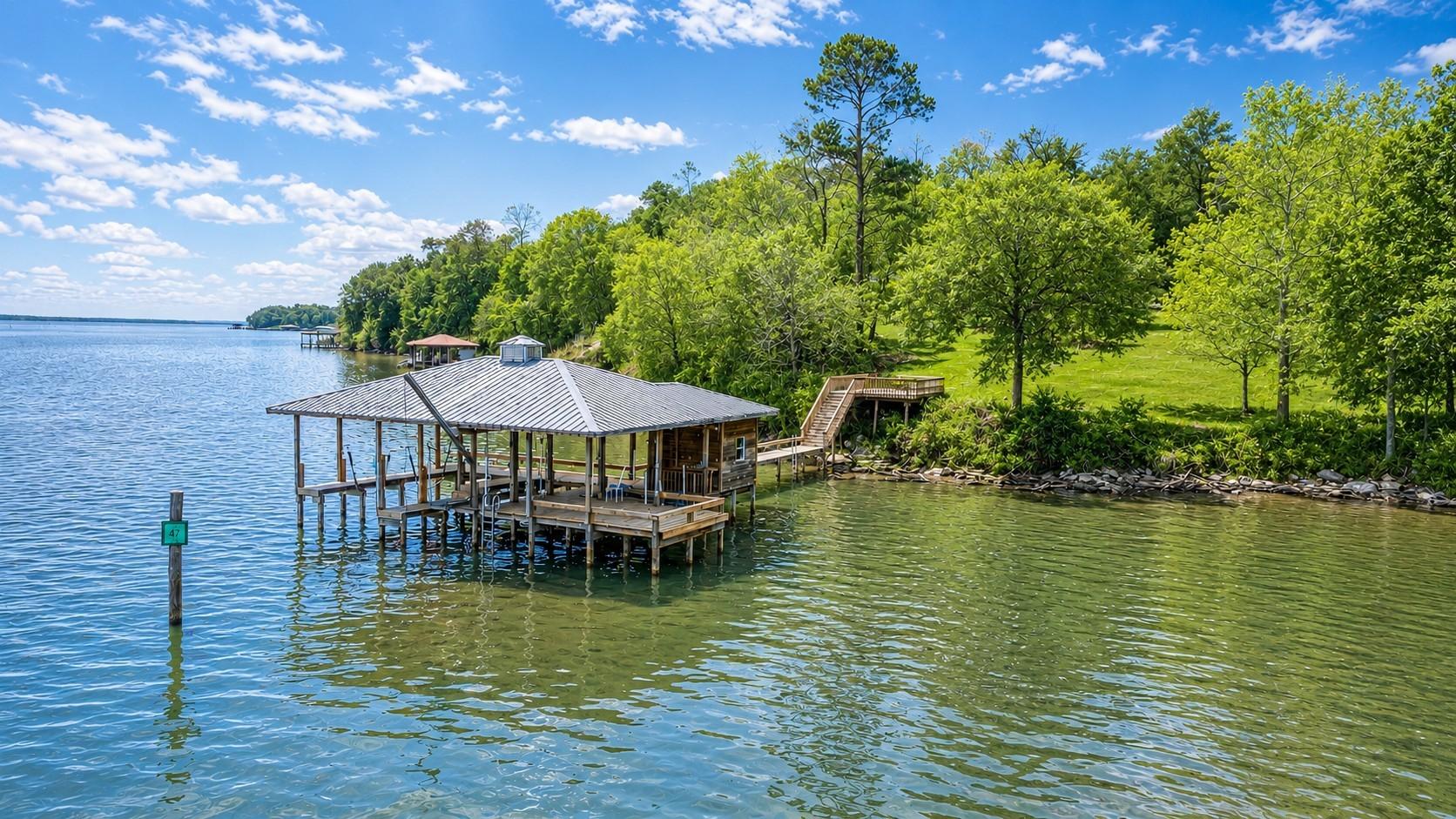 Image 4: This photo showcases a tranquil lakeside property