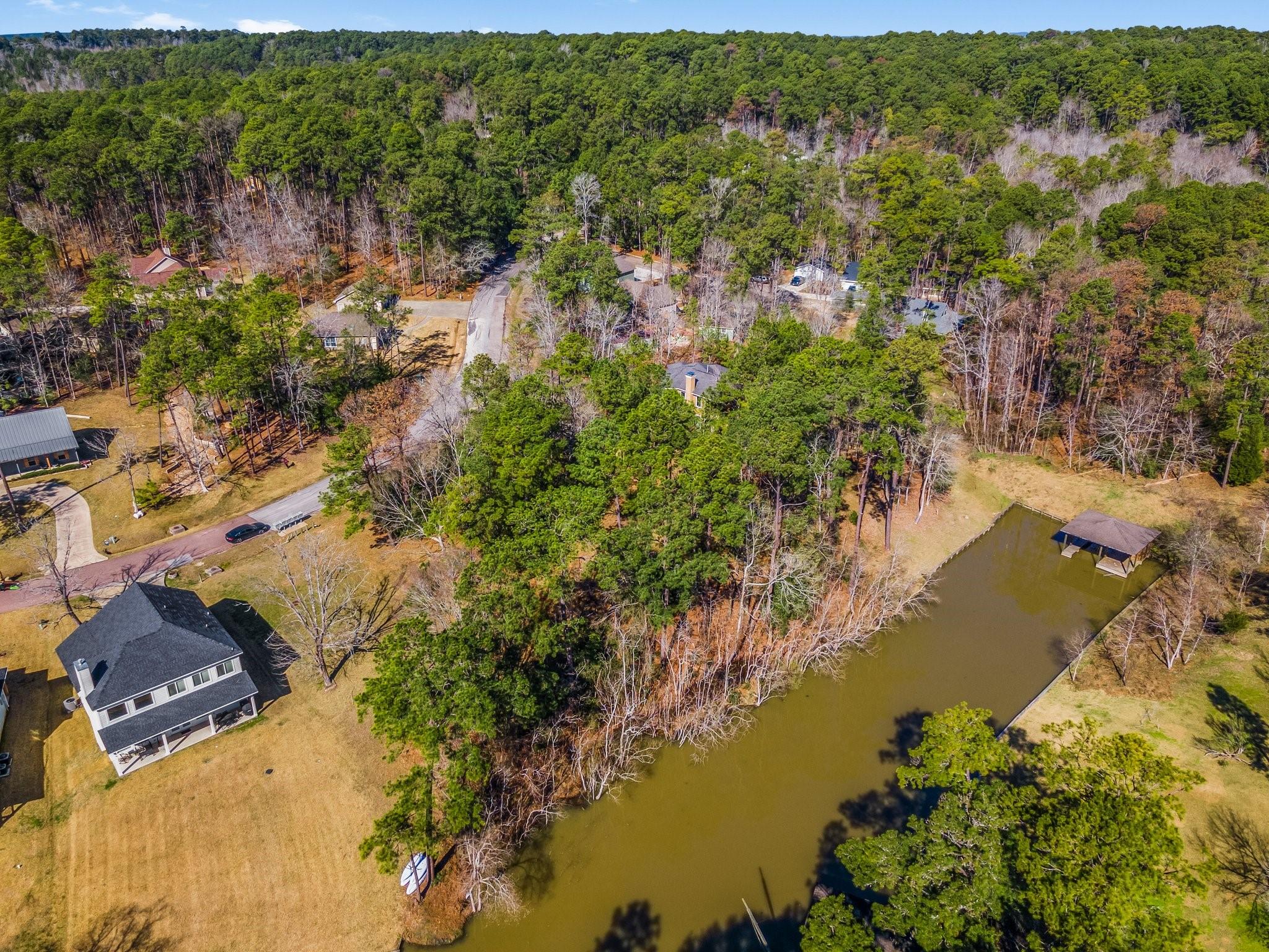 Image 4: The lot has a natural shoreline with direct water