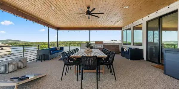Image 4: This spacious outdoor patio features a wooden ceil