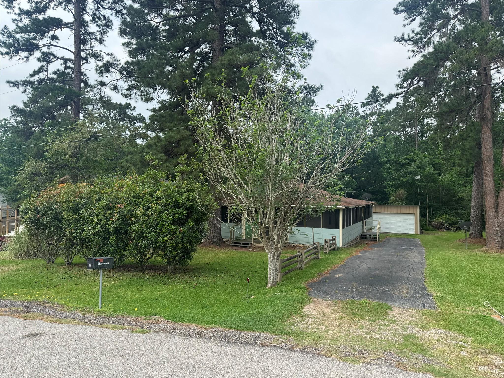 Image 2: The one story home sits on a 0.24 acre lot