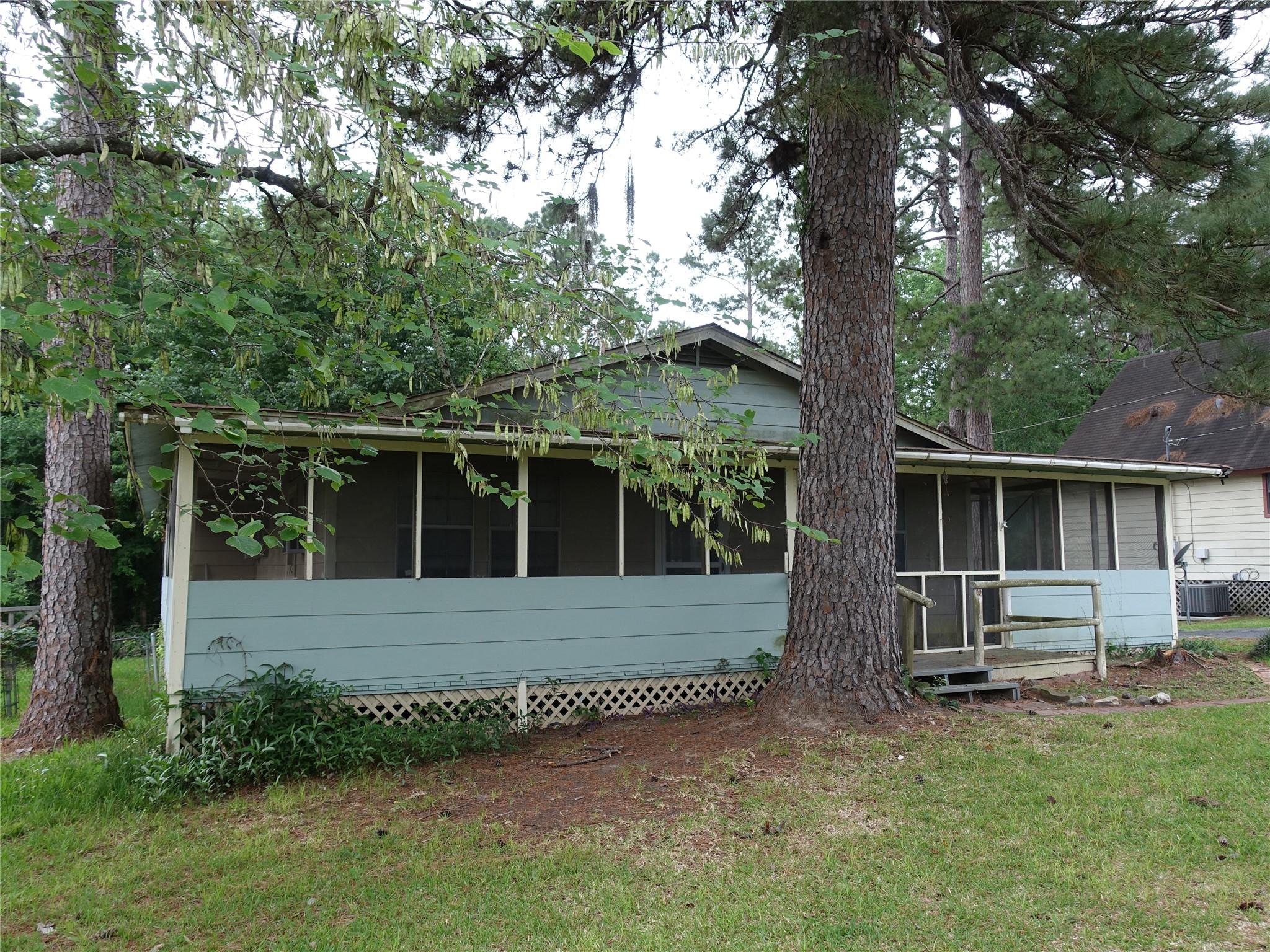 Image 3: The home has porches on all sides