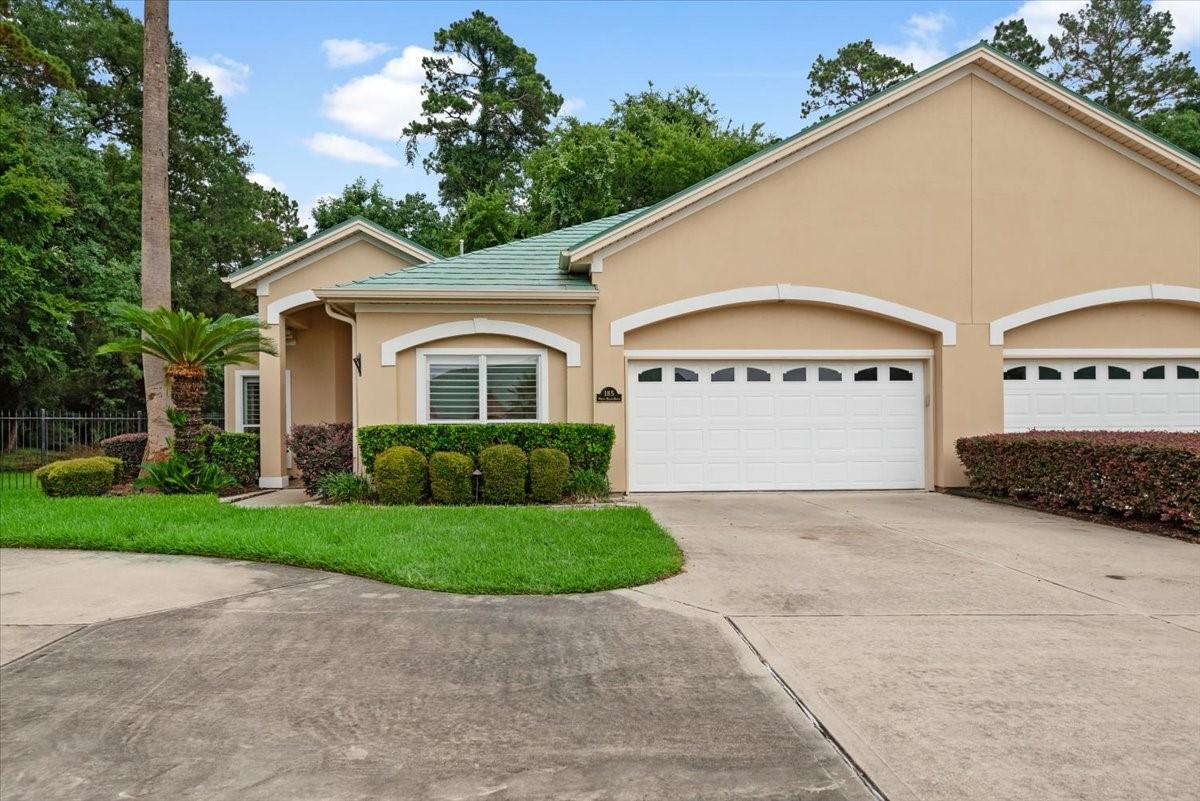Image 3: This charming single-story home features a stucco