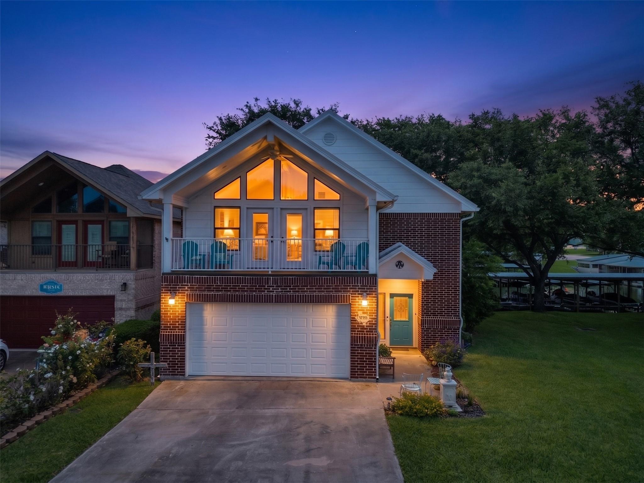 Image 1: Front of the home night shot