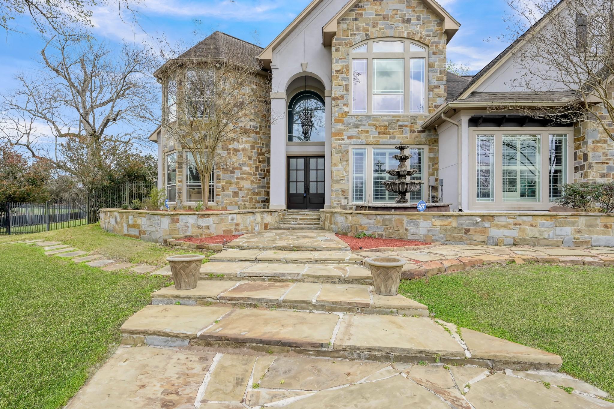 Image 4: A gorgeous fountain welcomes you to the home.