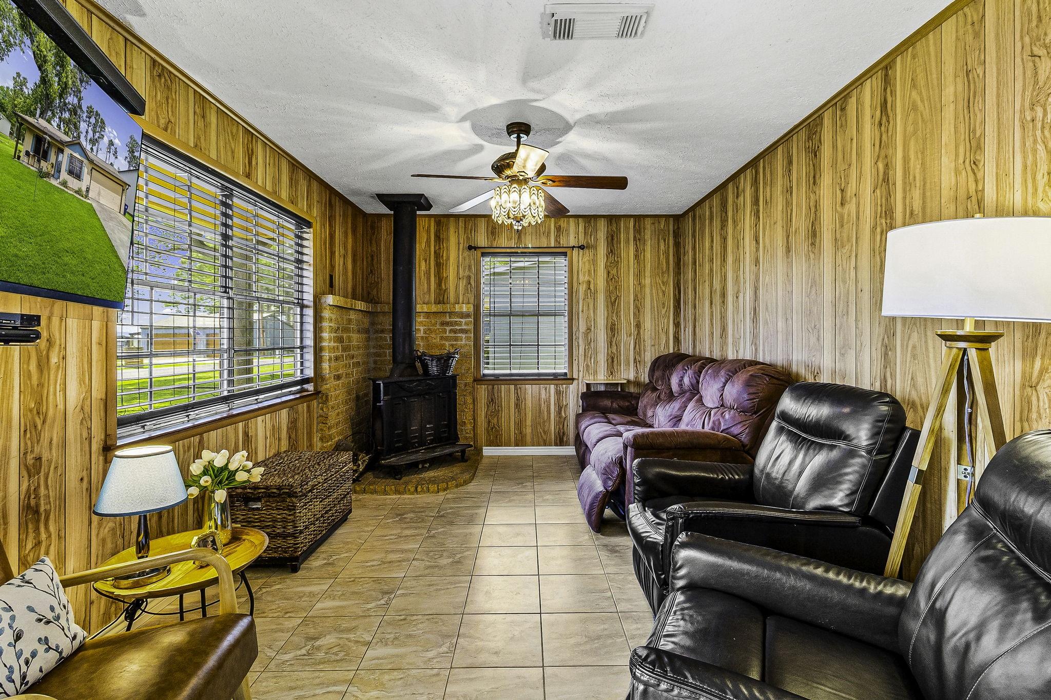 Image 3: Family room overlooks the lake