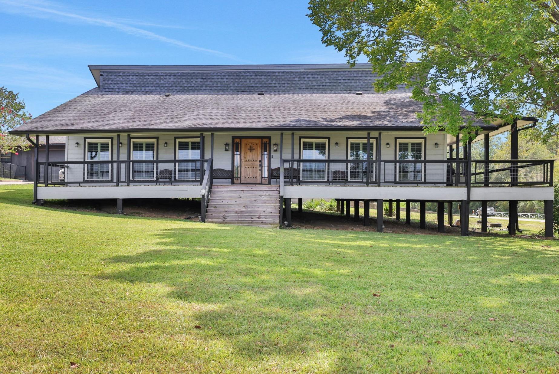 Image 3: Inviting front porch with comfortable seating, per