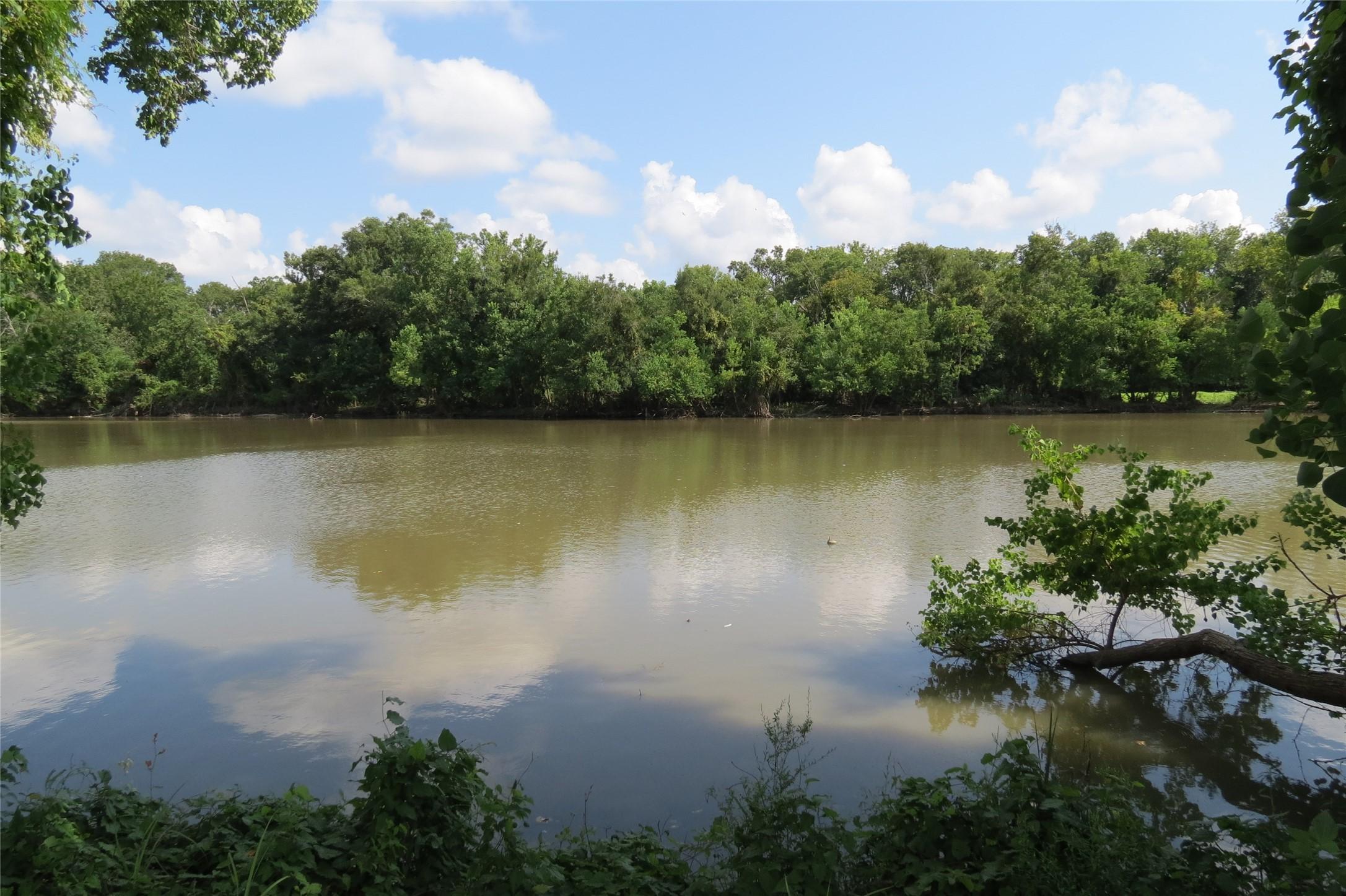 Image 1: Scenic view surrounded by lush greenery, natural v