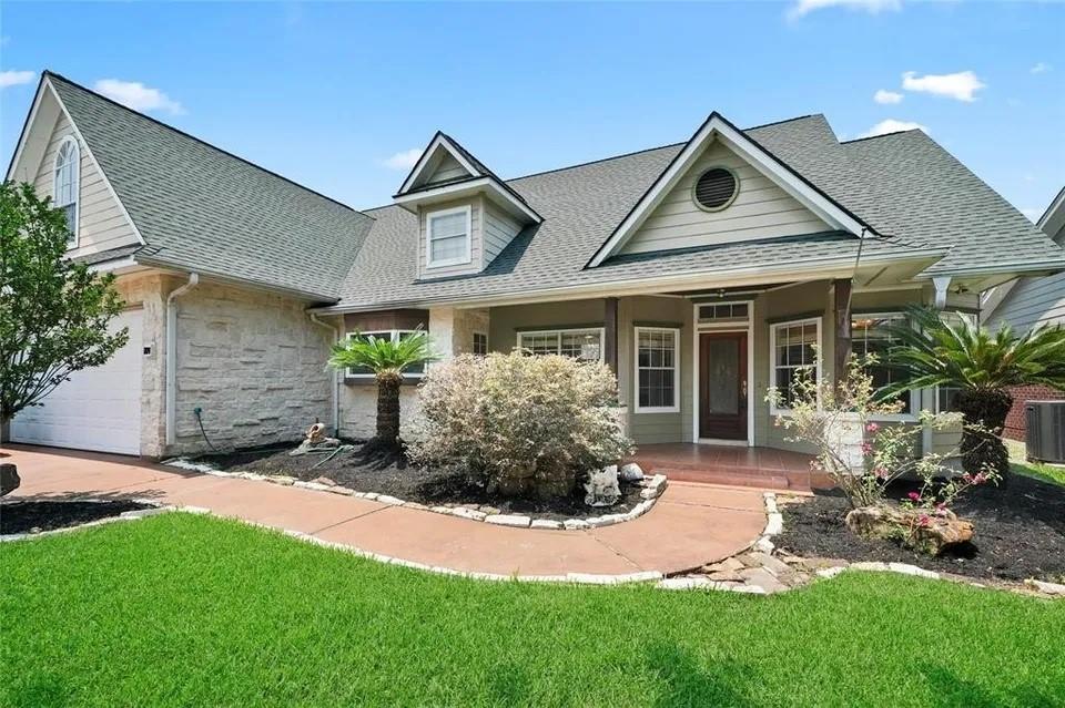 Image 1: Charming 1.5 story home with a gabled roof and spa