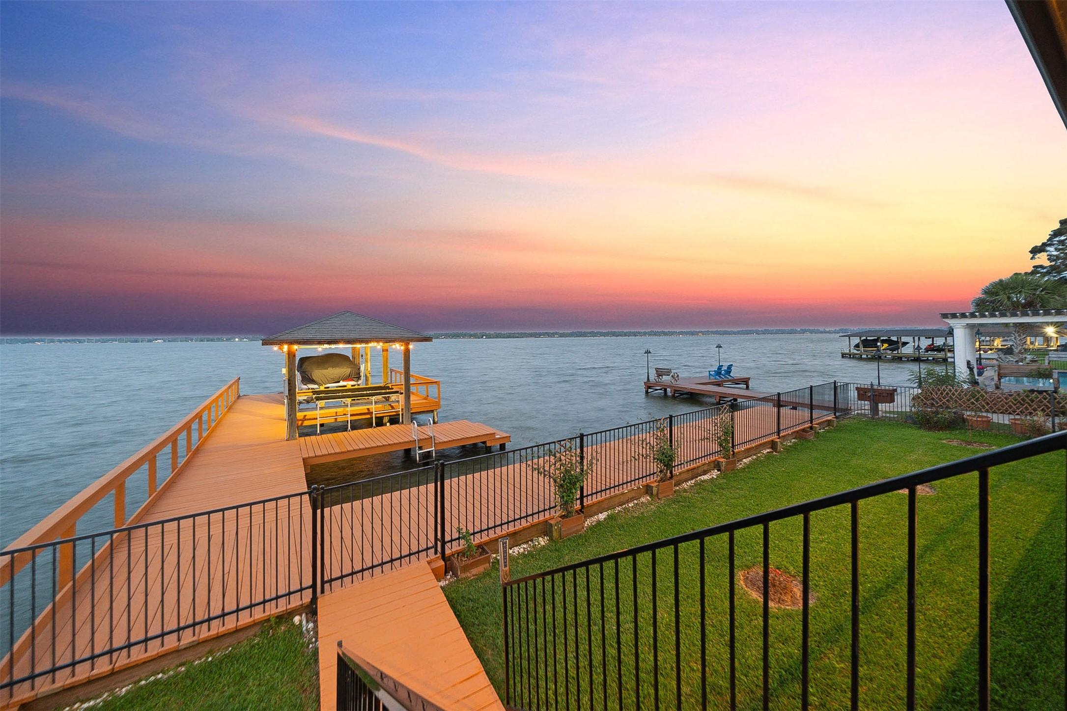 Image 2: Incredible backyard , wrought iron fencing, pier,