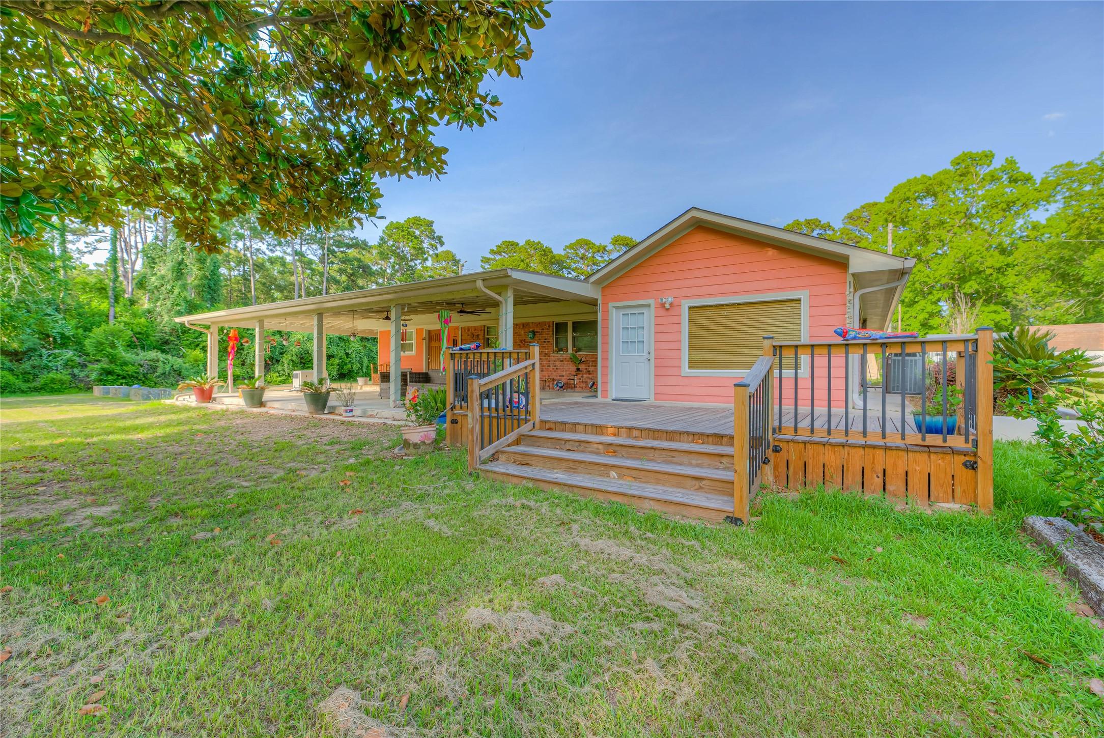 Image 2: Beautiful back deck and covered concrete porch ove