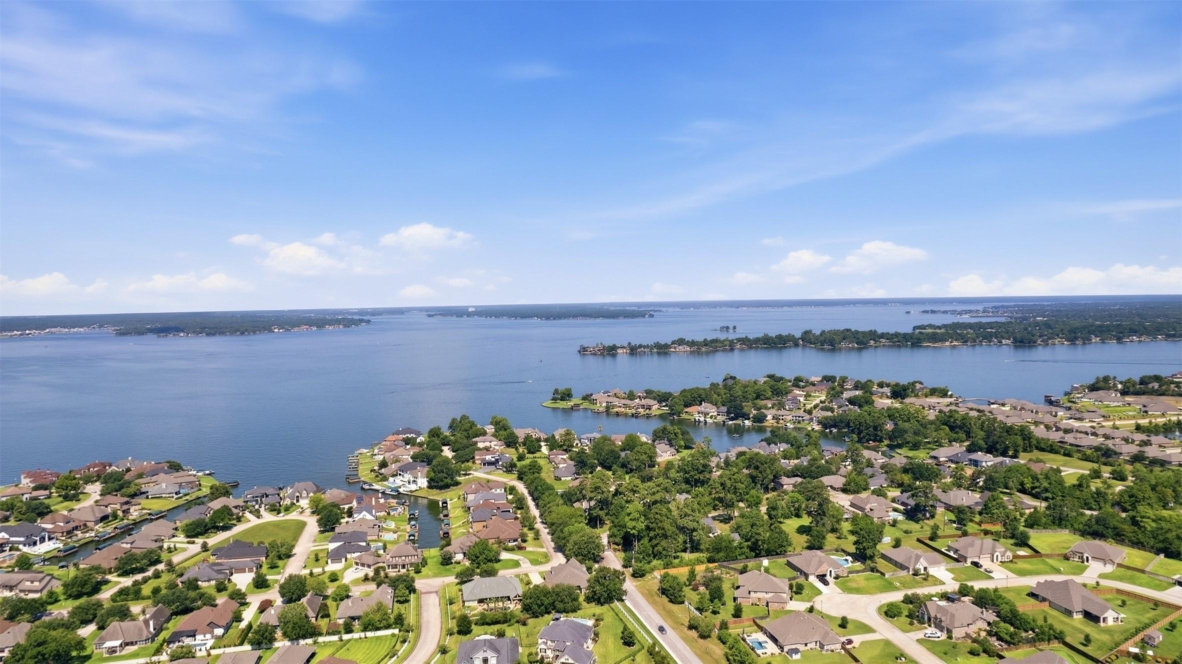 Image 2: Lake Conroe is a short golf cart ride away....you