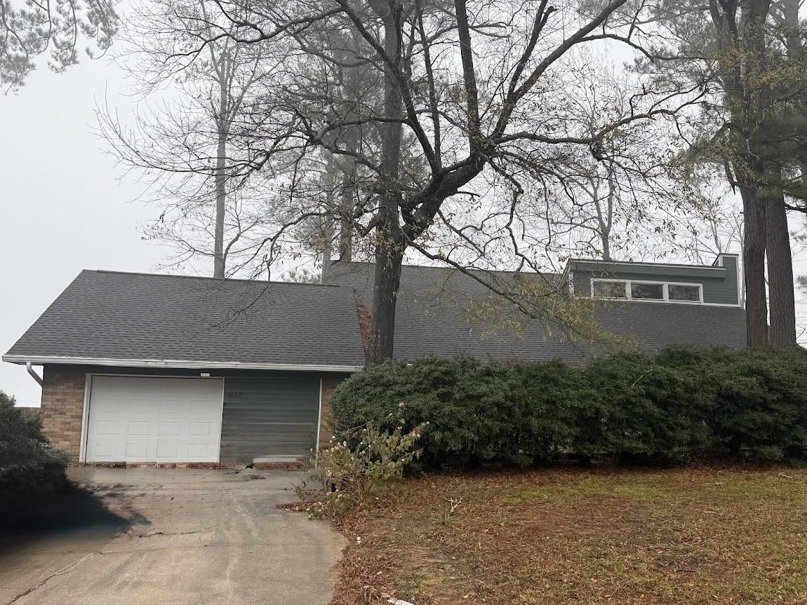 Image 3: This home has a newer roof with a fresh exterior p