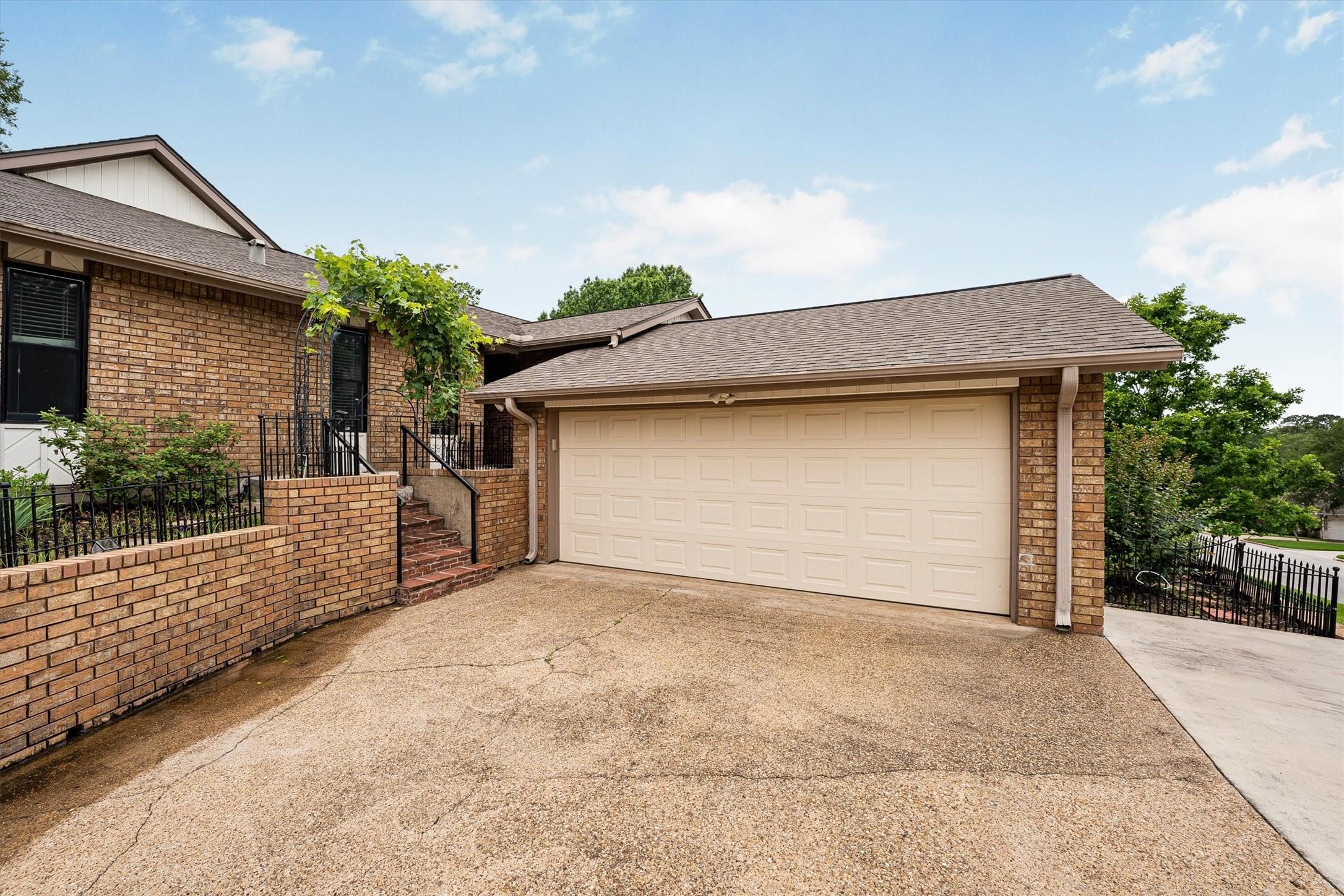 Image 3: Inviting approach with a two-car garage highlight.