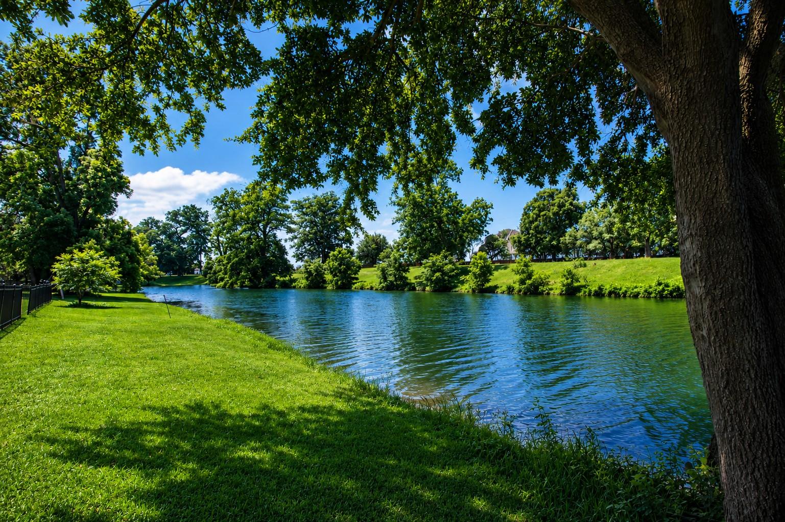 Image 3: Backing directly to Pecan Lake, the property enjoy