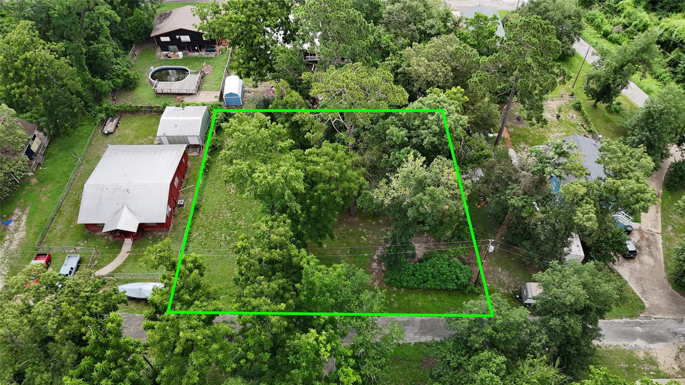 Image 4: This aerial photo shows  the lush, wooded property