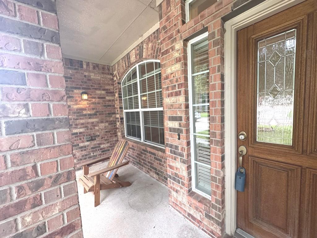 Image 2: Relax on the welcoming front porch and enjoy peace