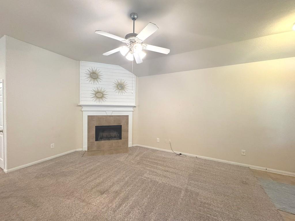 Image 3: Spacious living room with high ceilings and a cozy