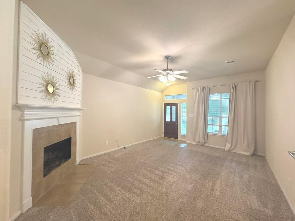 Image 4: Another view of the living room with neutral tones