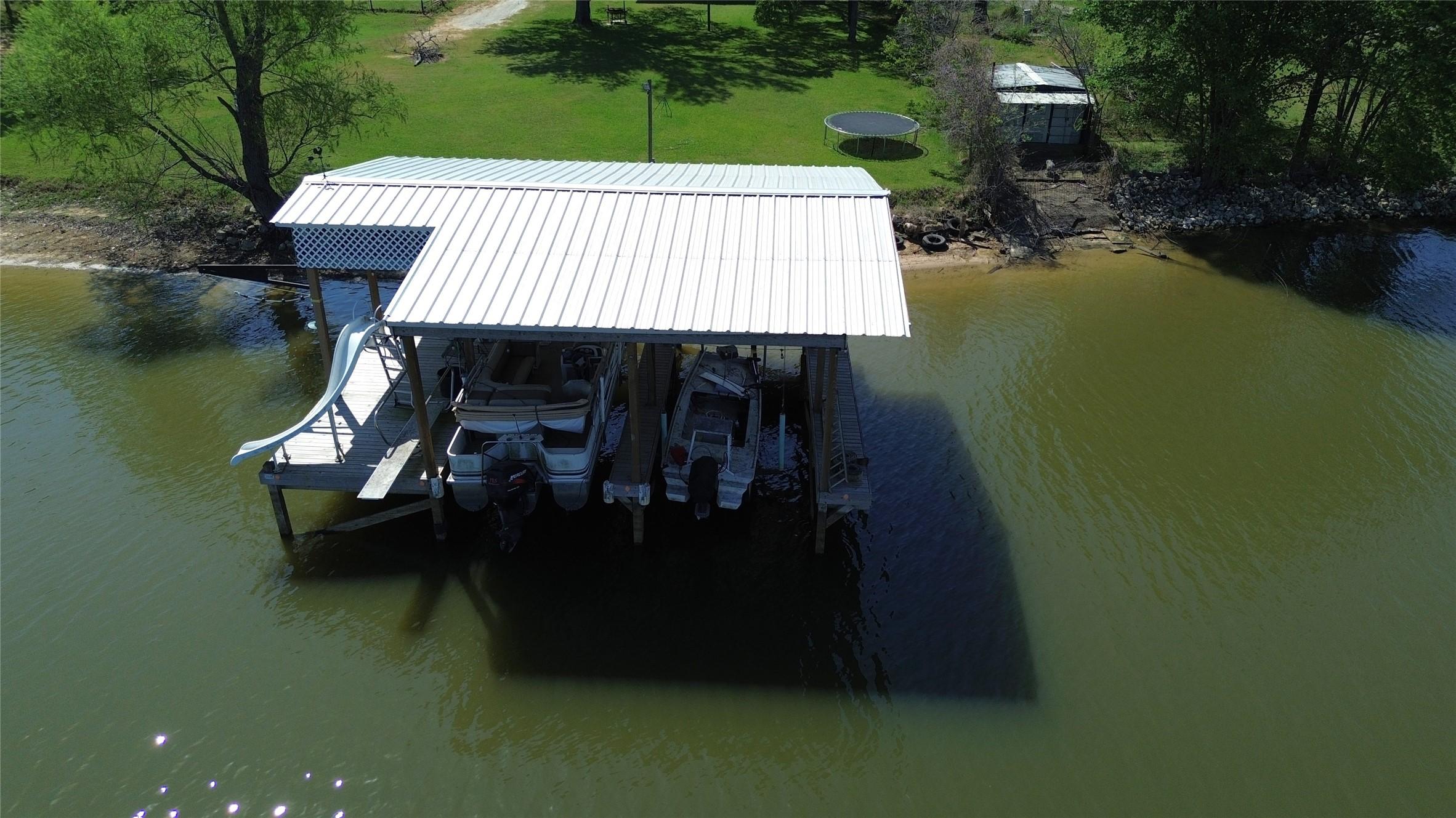 Image 3: 2 Slip Boat House with Water Slide