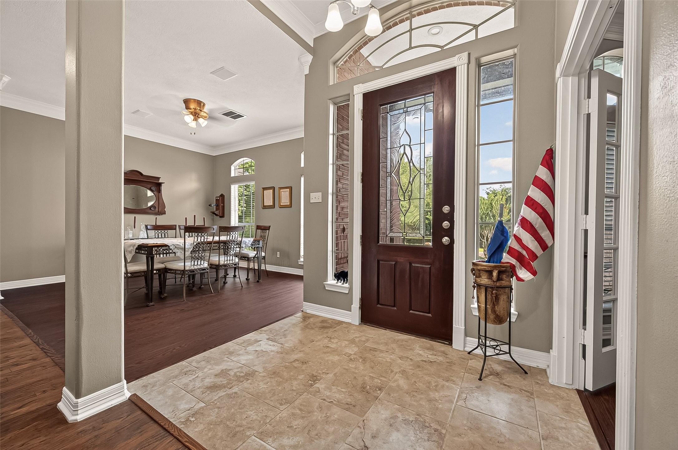 Image 3: Foyer with the formal dining on the left side and