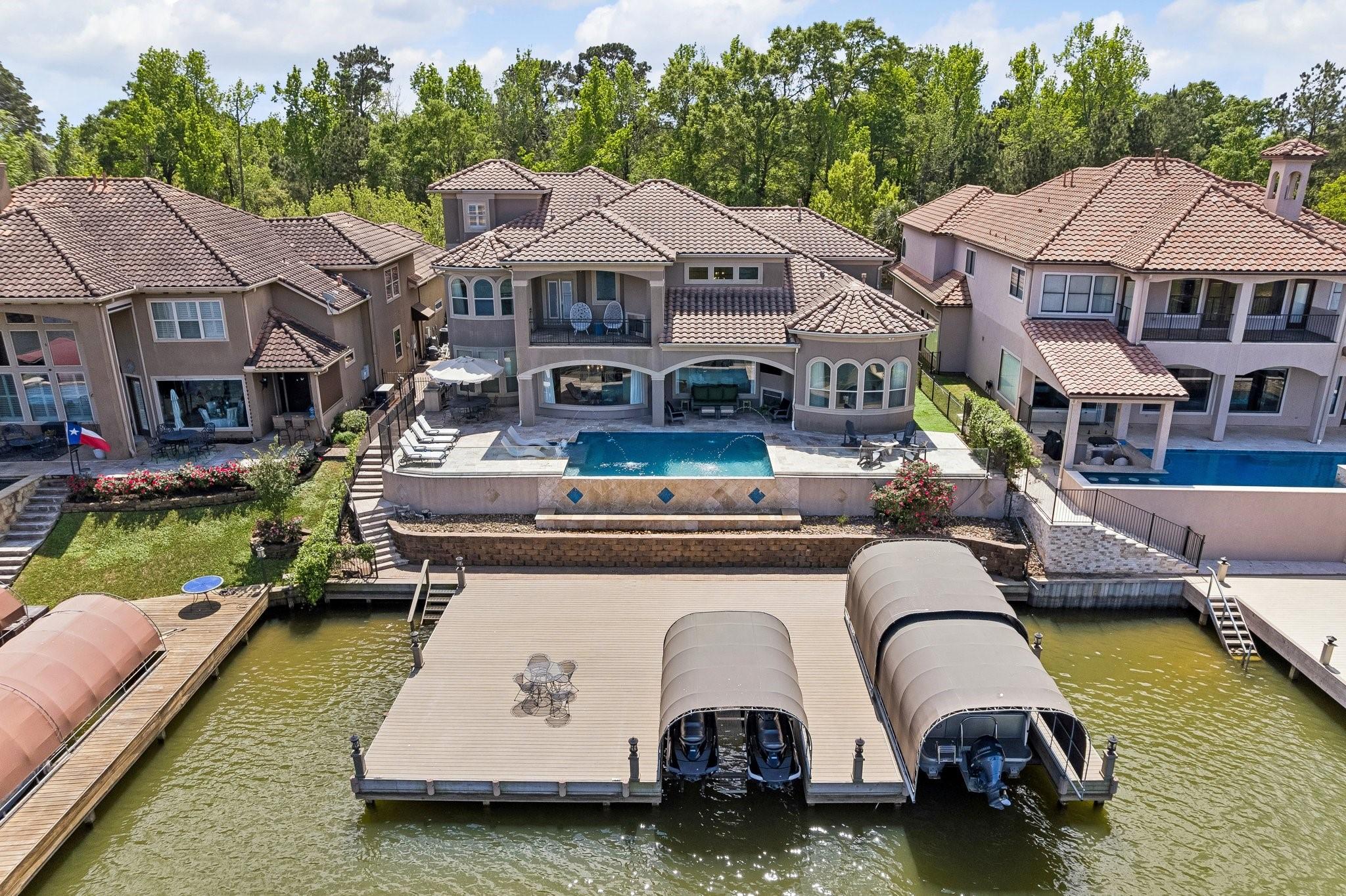 Image 1: An idyllic Lake Conroe home with five bedrooms, a