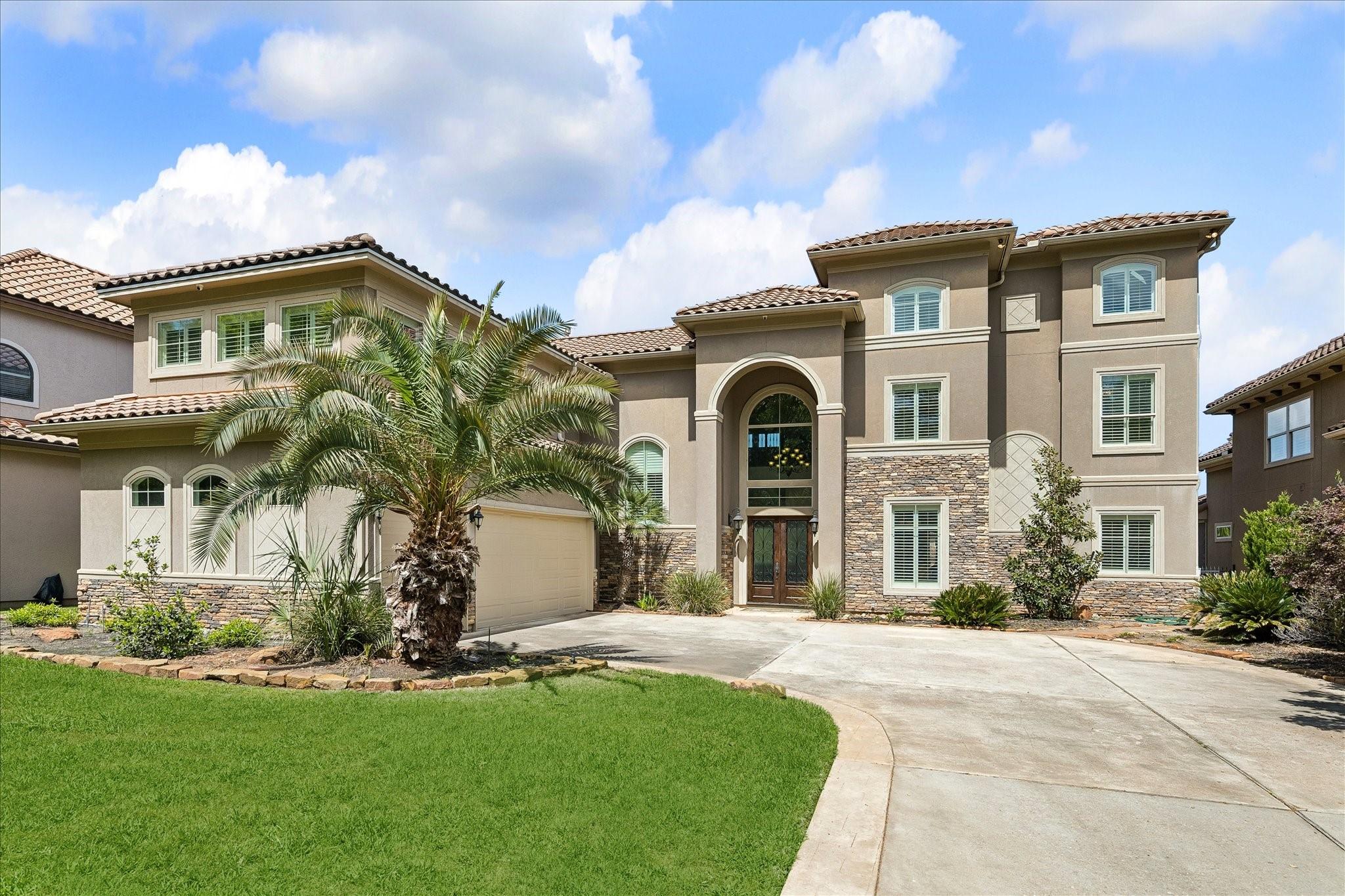 Image 2: Front view of Paradise 
Oak. Three-car garage, do