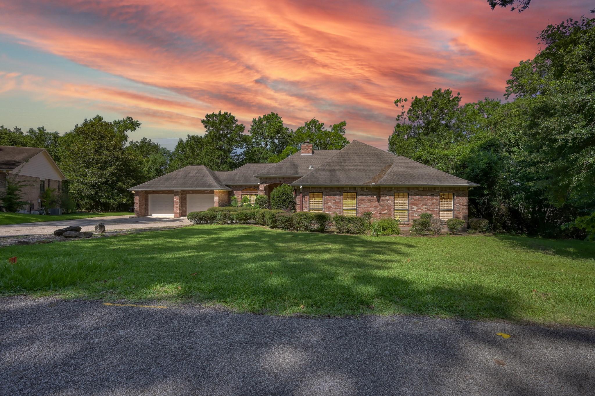 Image 2: Charming brick home with a spacious front lawn, ne