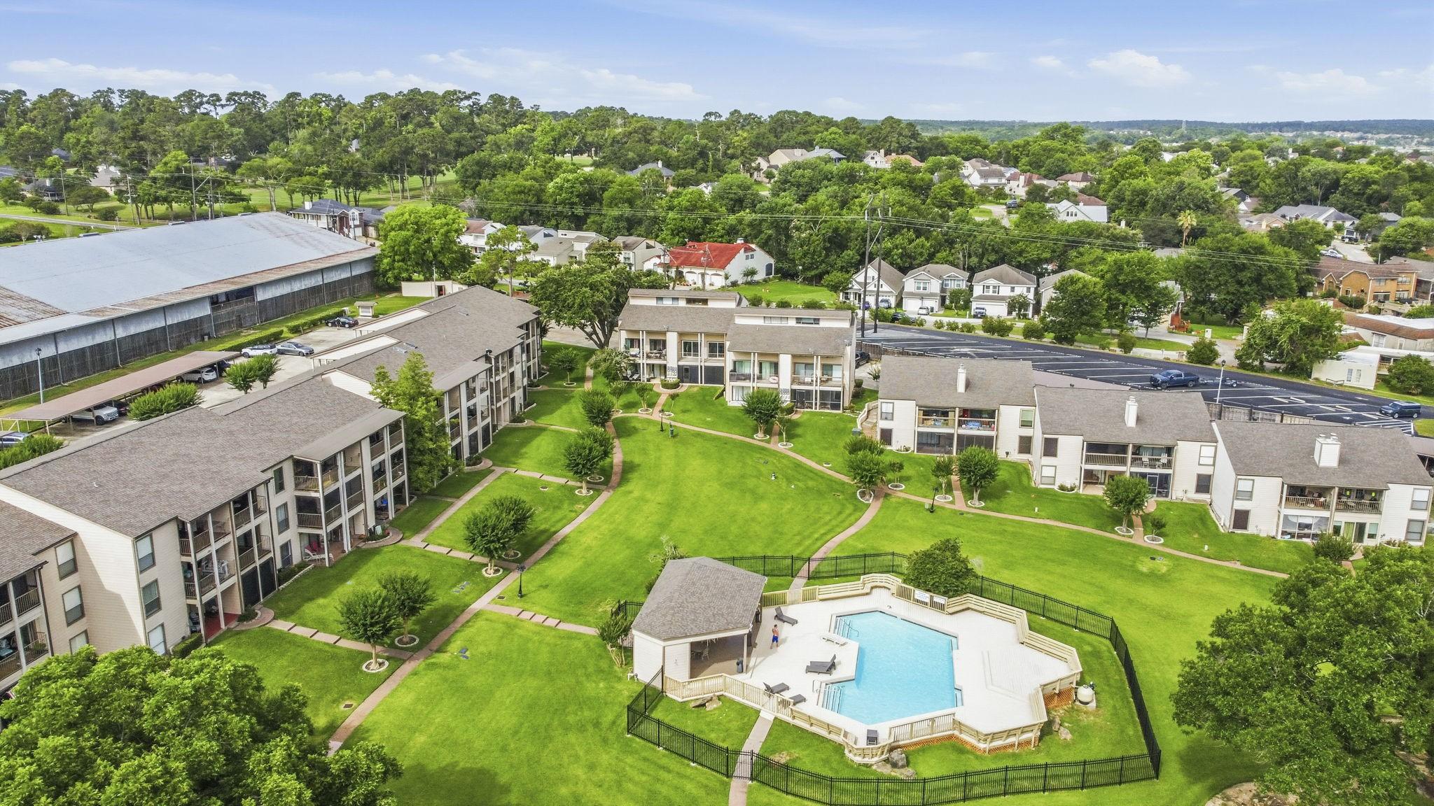 Image 2: Condo overlooks the community pool.