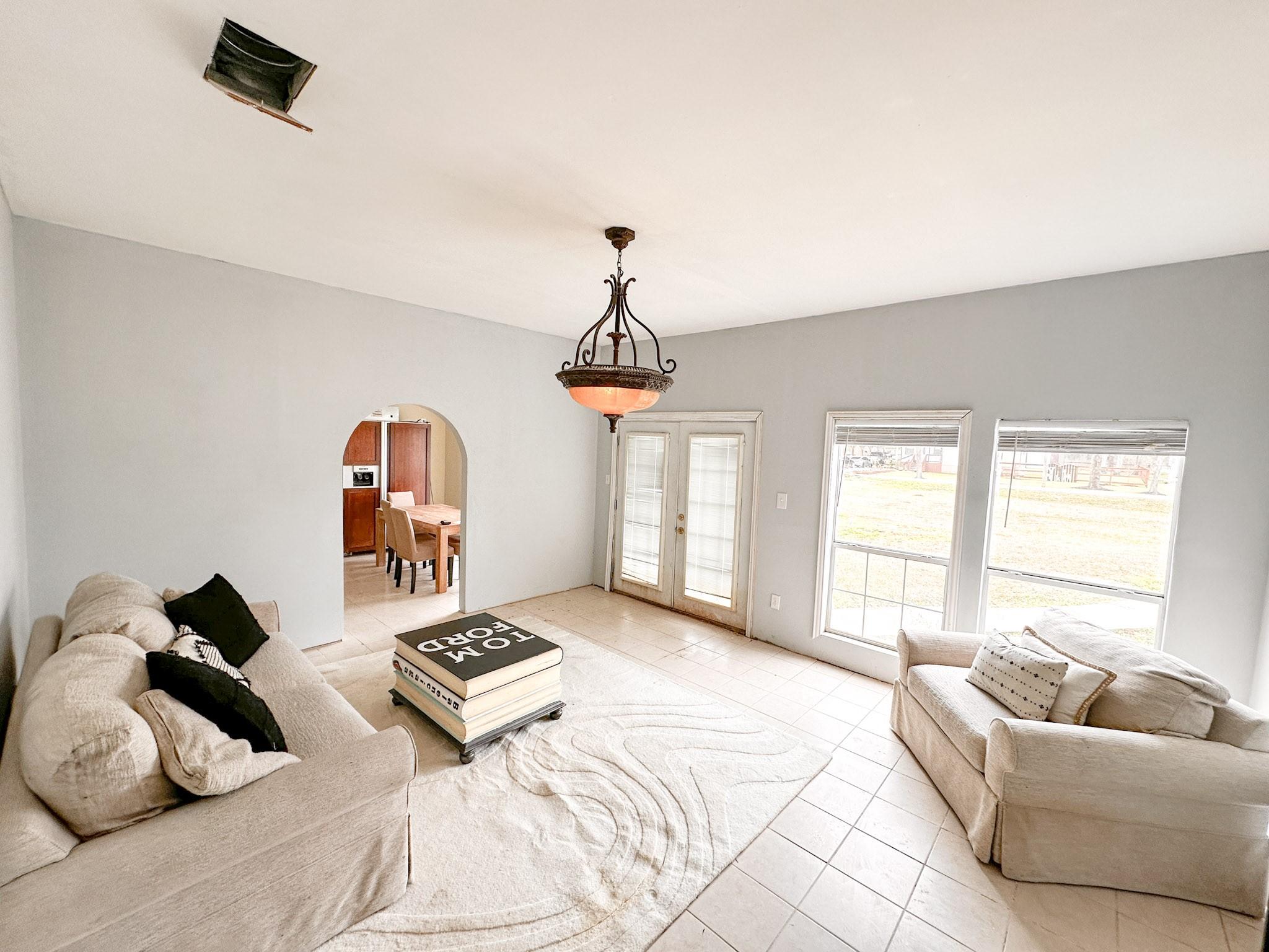 Image 4: The living area is spacious and has so much light.