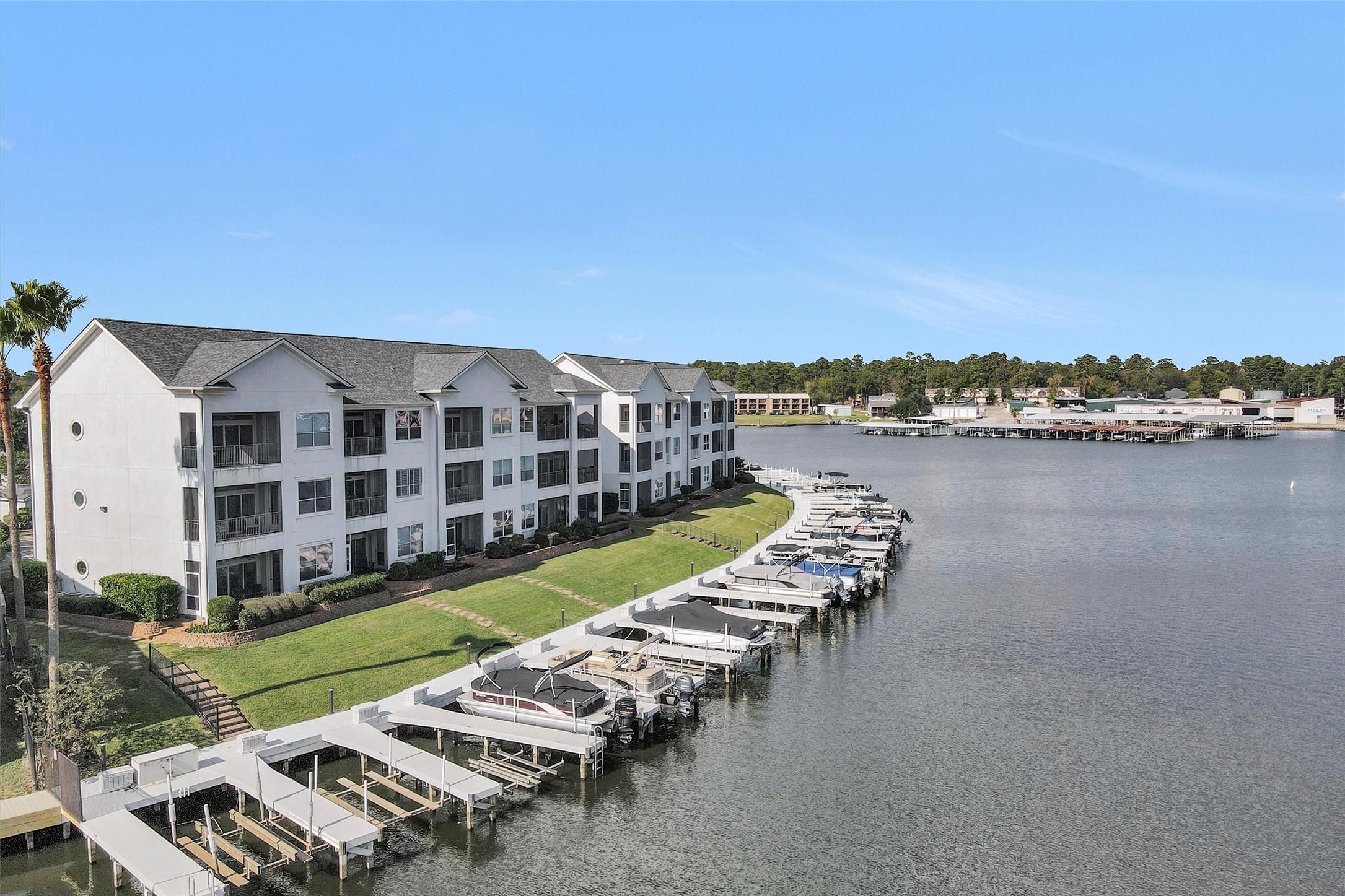 Image 1: his photo showcases a waterfront condominium compl