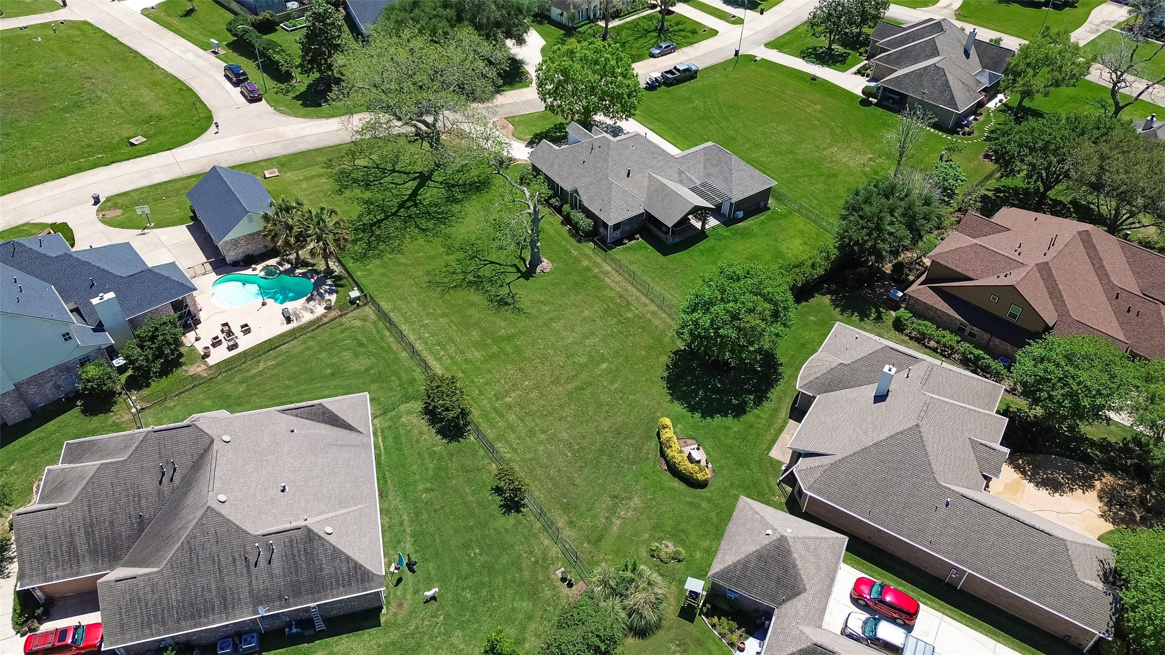 Image 2: Mature trees on the lot provide natural beauty and